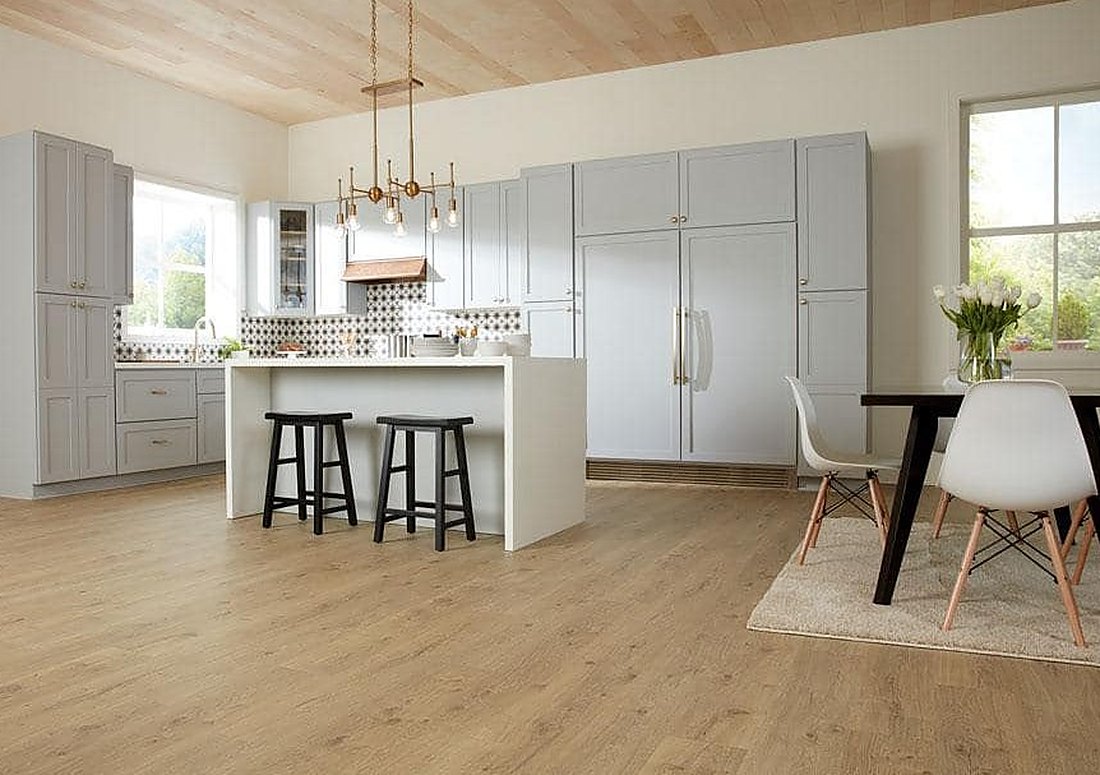 Light oak look laminate in a white kitchen in a Greenville colonial, Brazil Floors