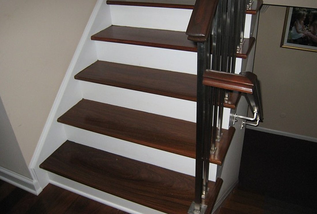 Dark stained treads over bright white risers in a Woonsocket colonial, Brazil Floors