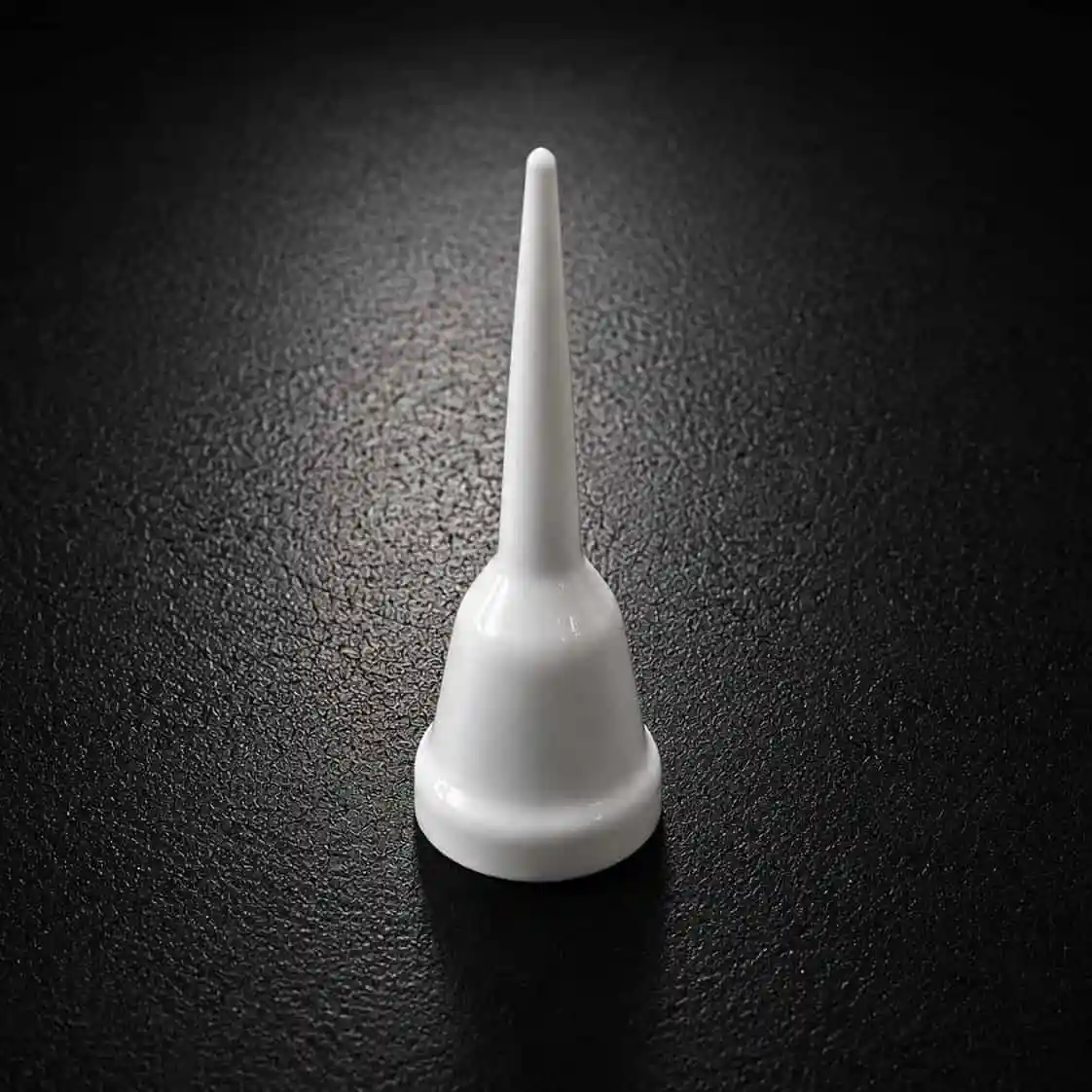 Custom white flexible PVC cap manufactured using precision dip molding.