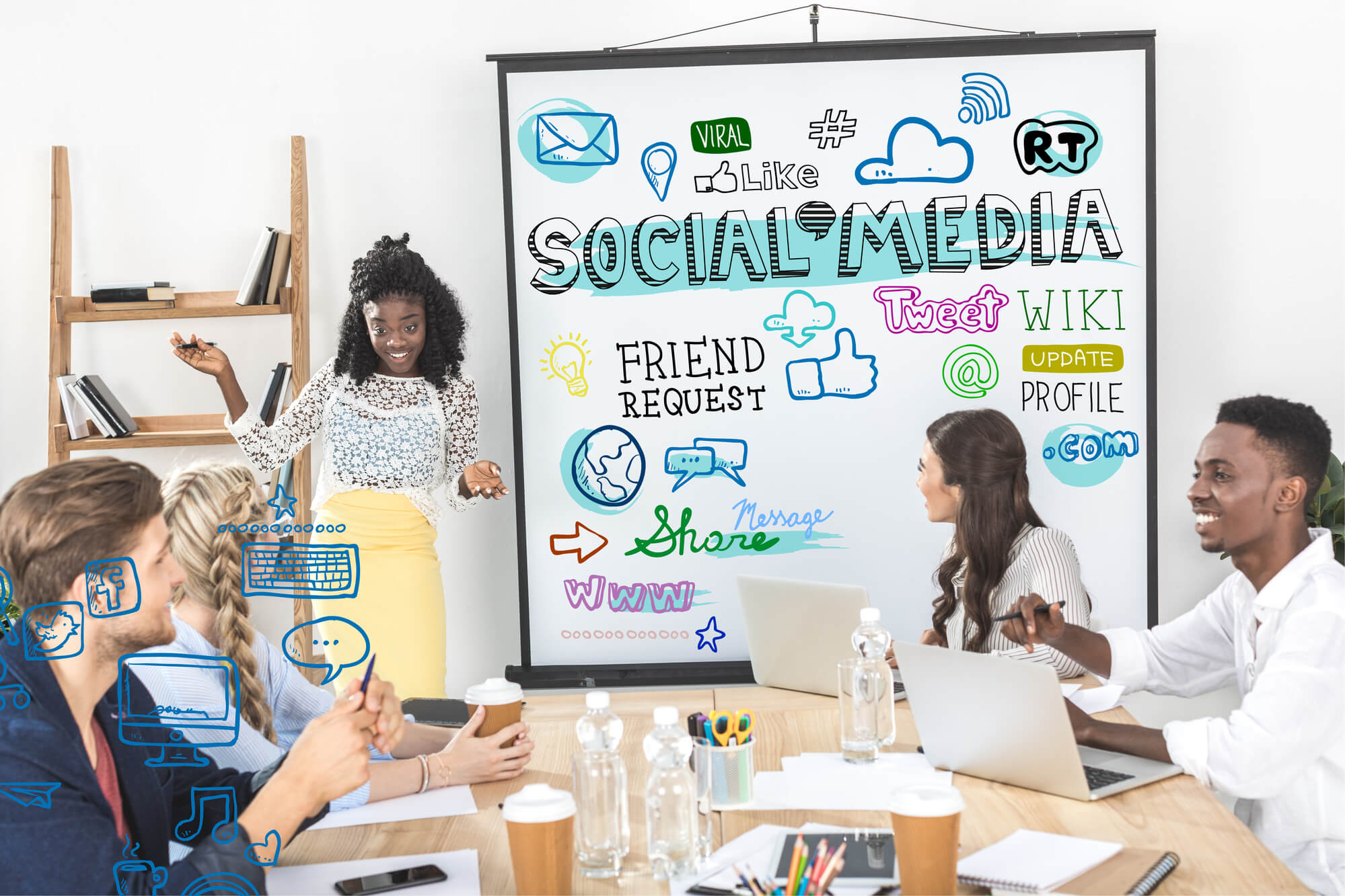 Marketers discuss social media with team. 