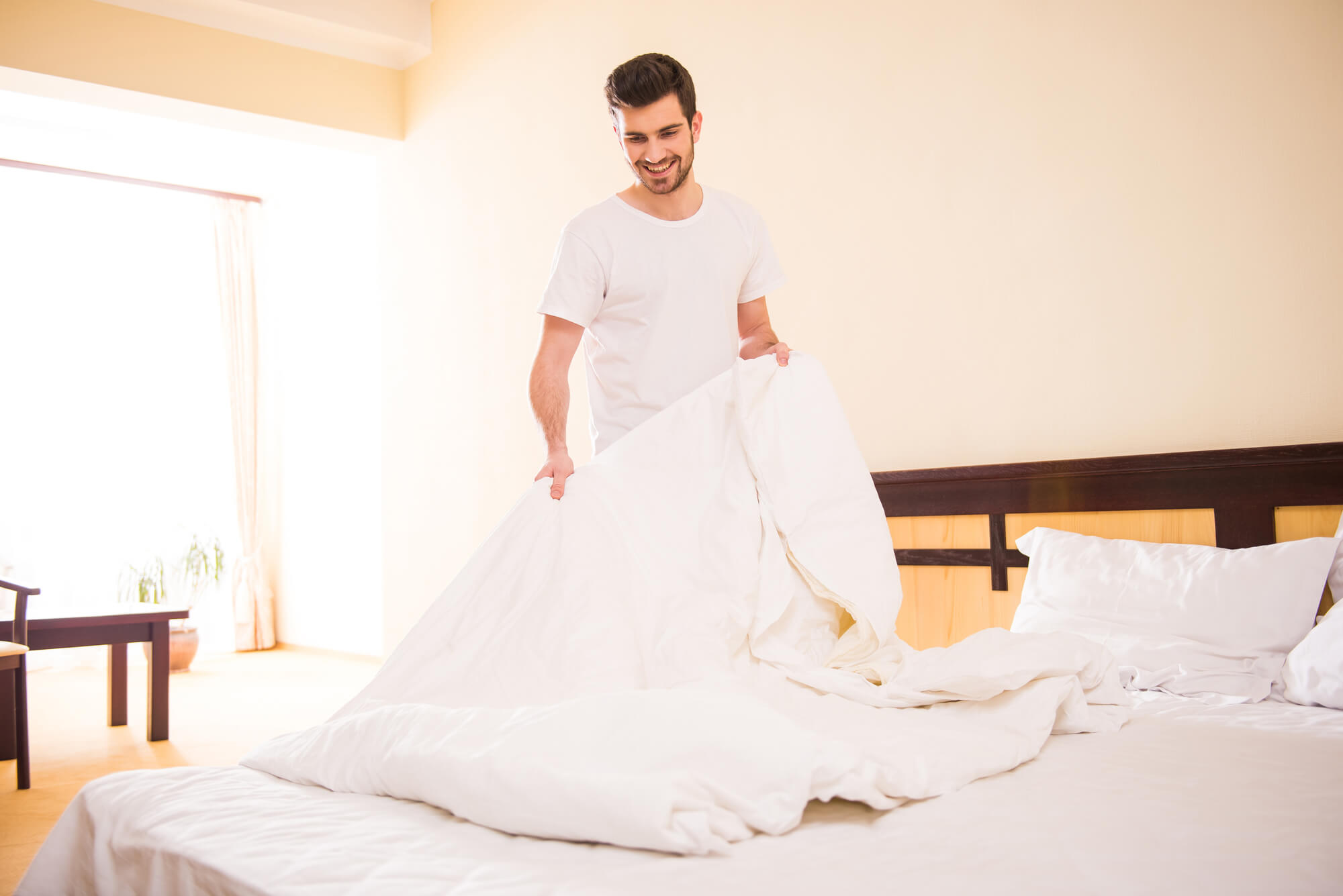 Man making his bed