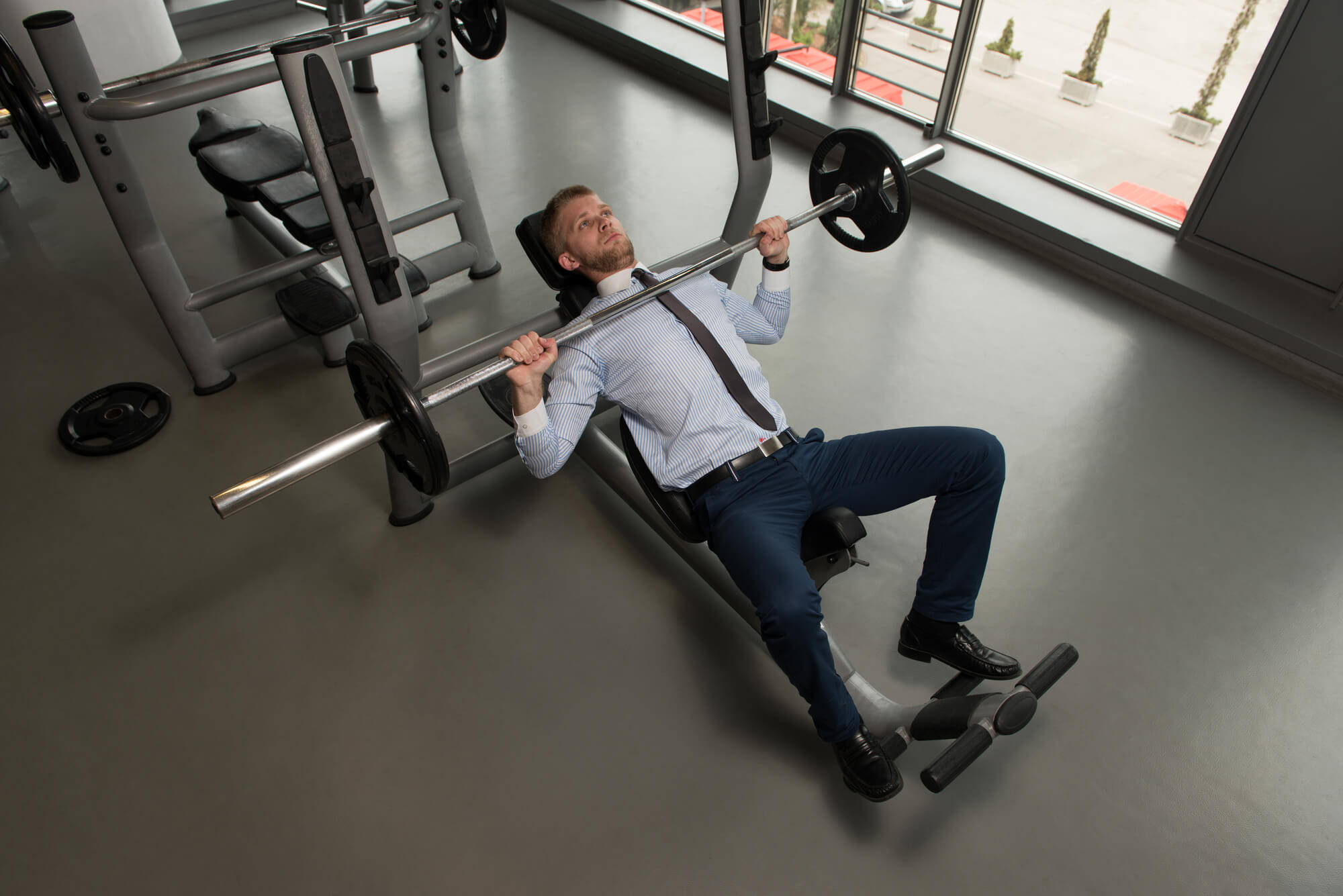 businessman doing bench presses