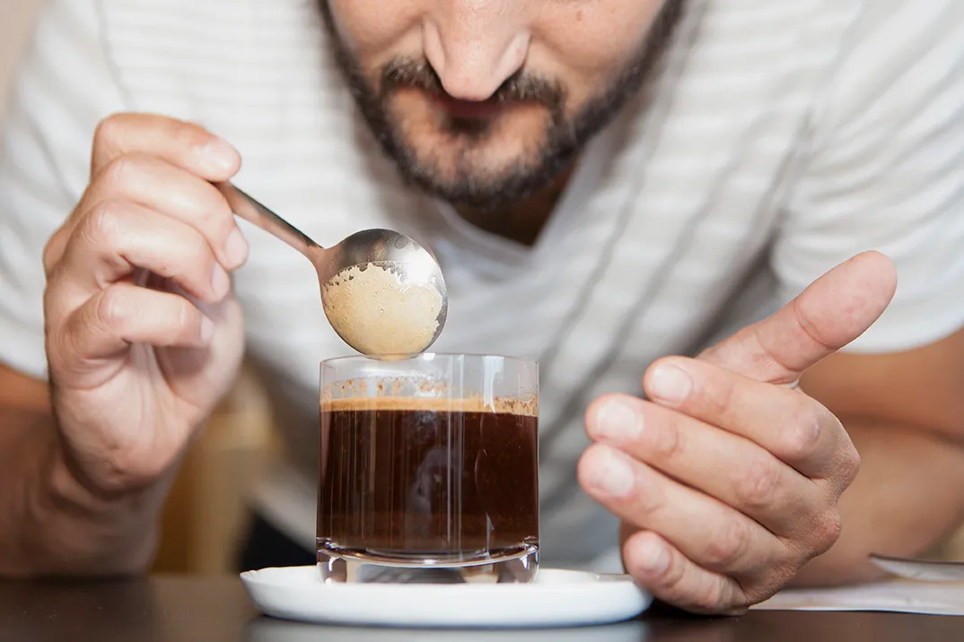 A WIRED staffer participates in a coffee tasting held at the WIRED Offices.