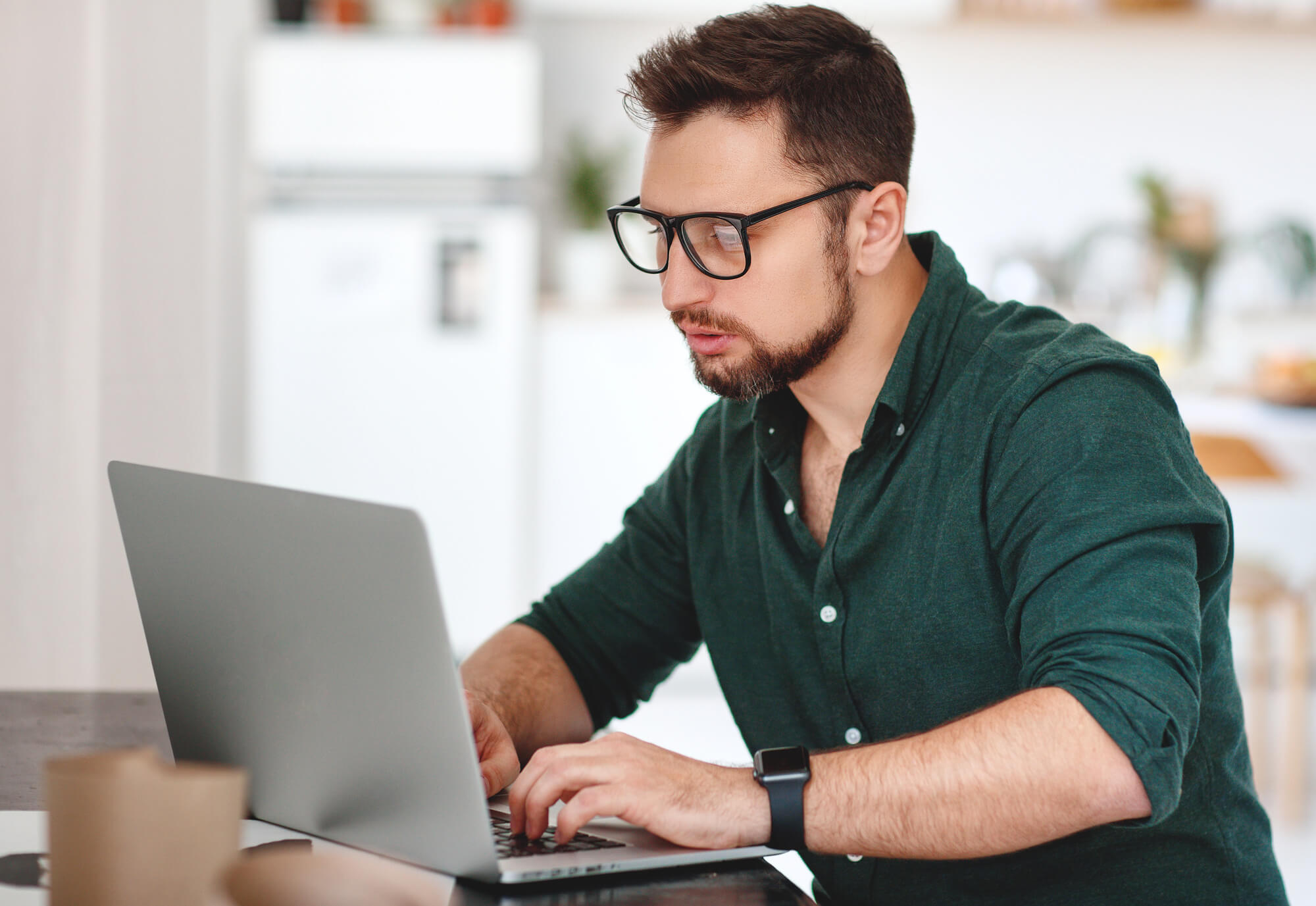 Male professional focused on working on his laptop
