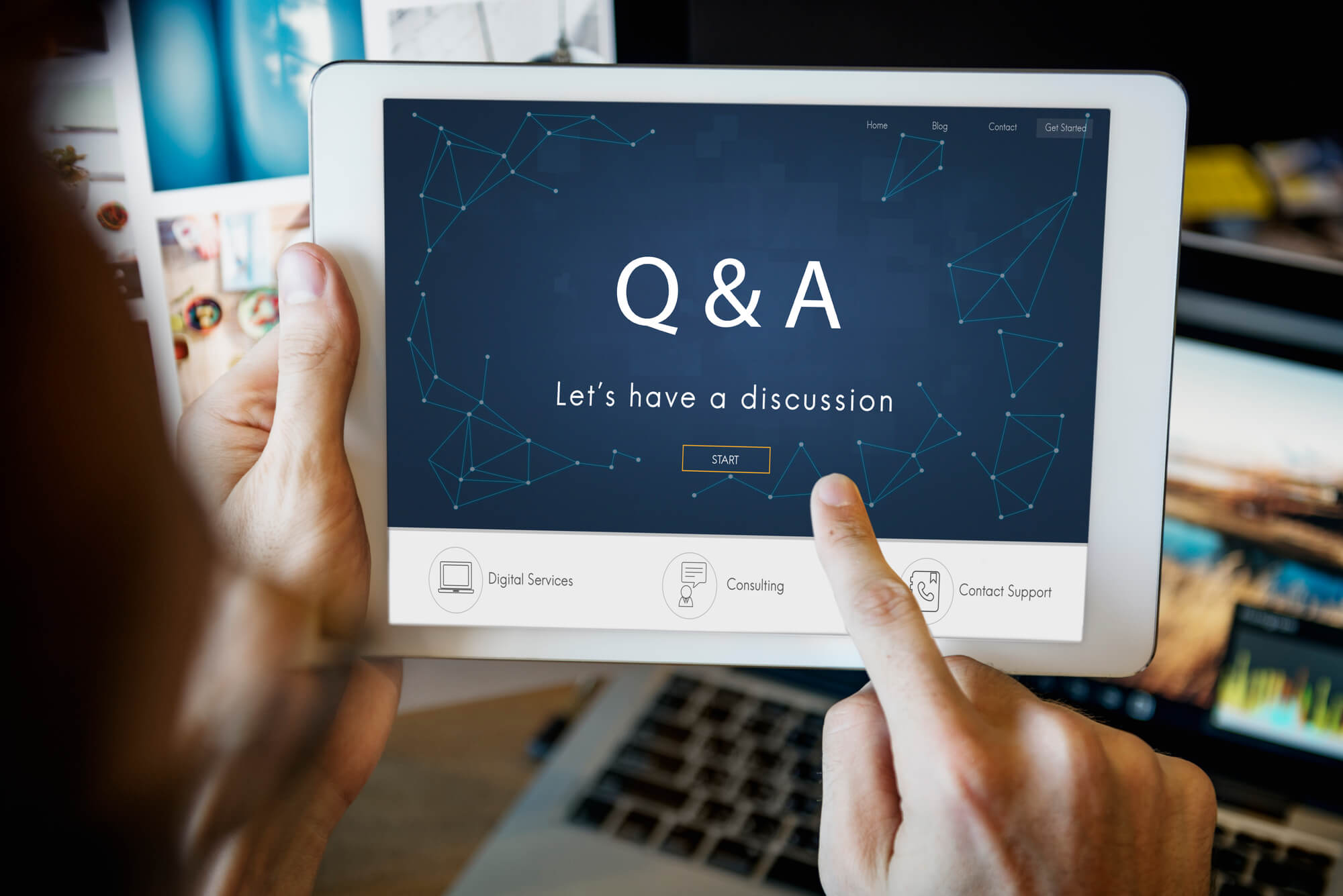 man looking at mobile tablet with q & a on screen