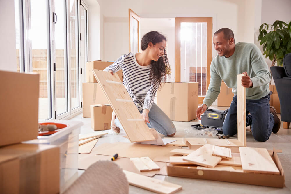couple trying o assemble DIY furniture