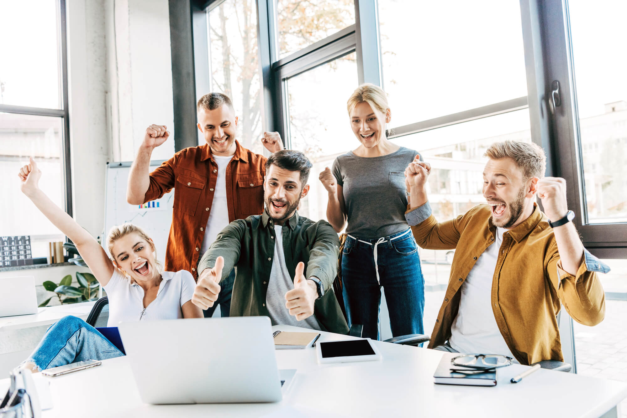 group of digital marketers celebrating success