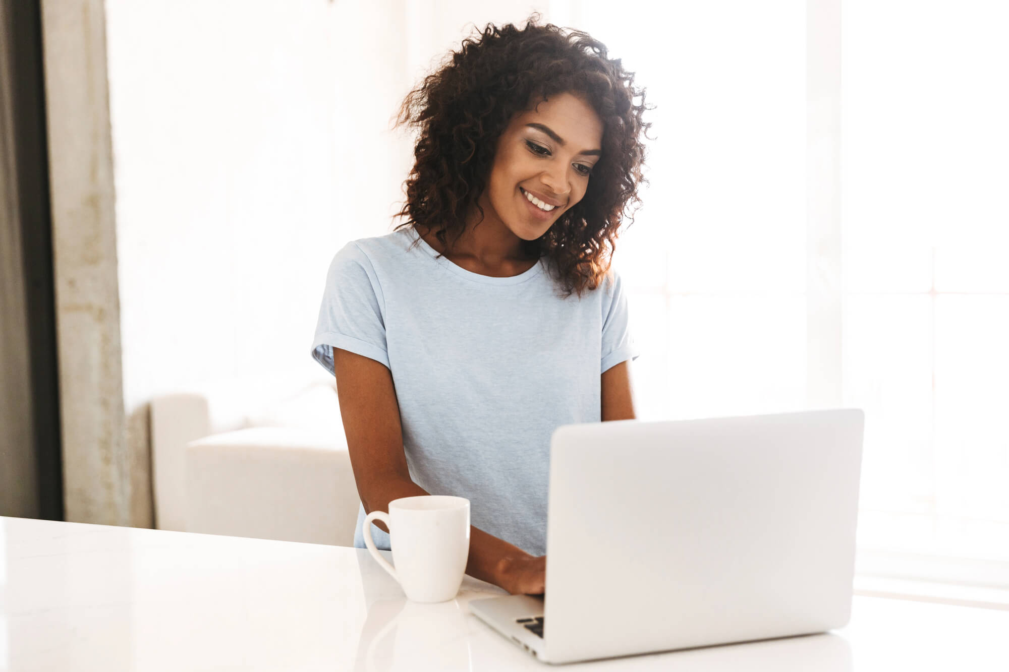 happy woman using laptop