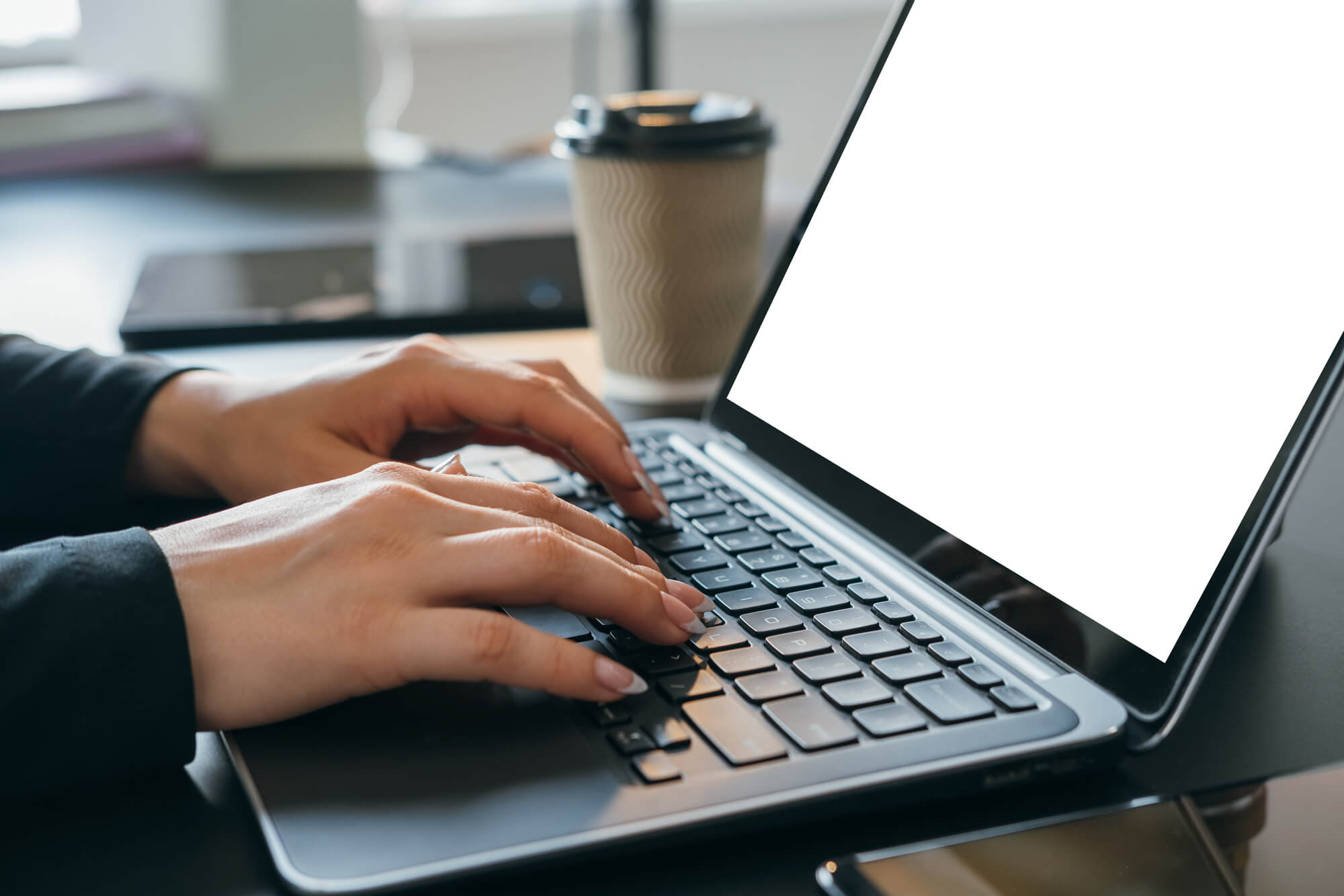 woman typing on laptop