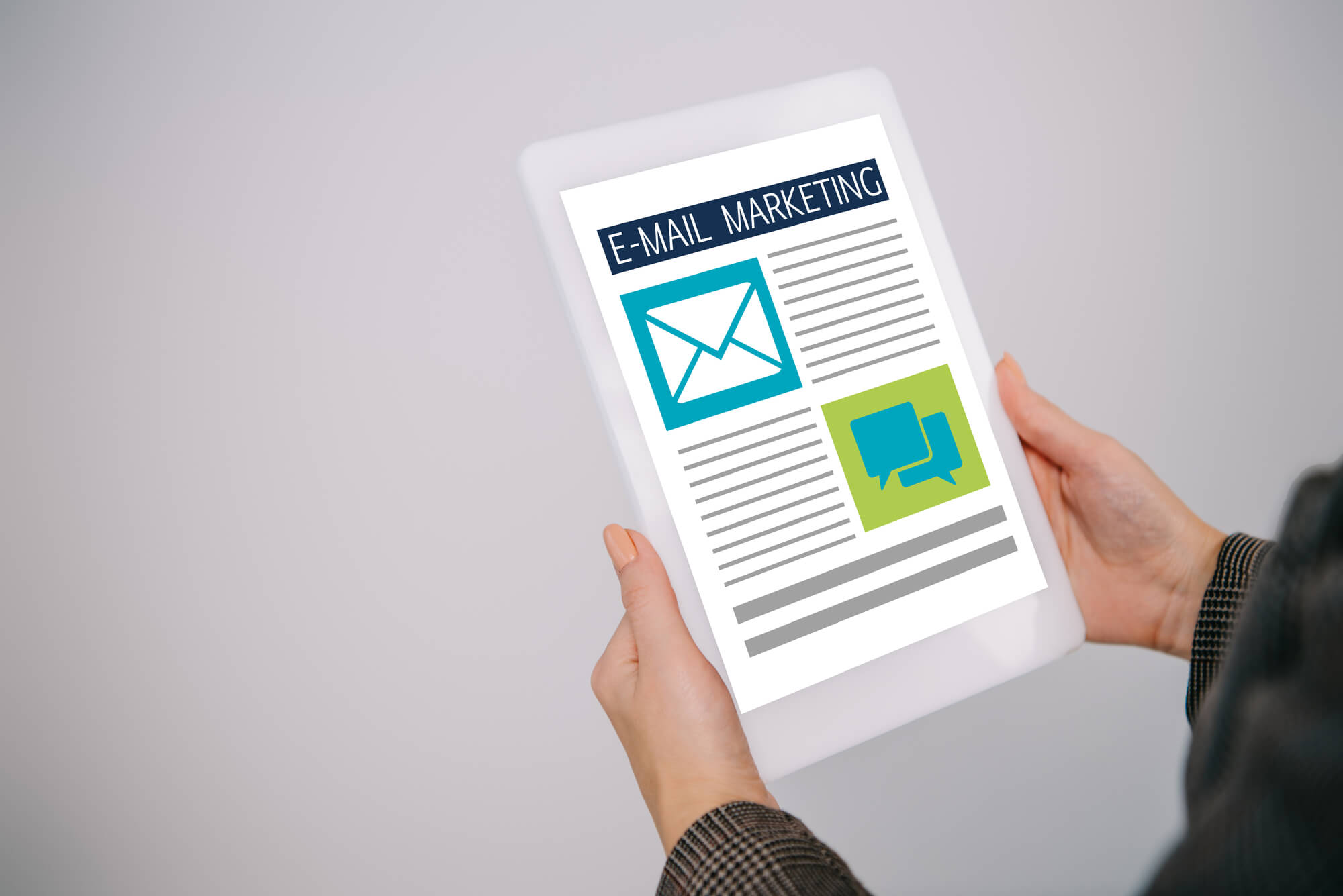 woman holding tablet with email marketing on screen