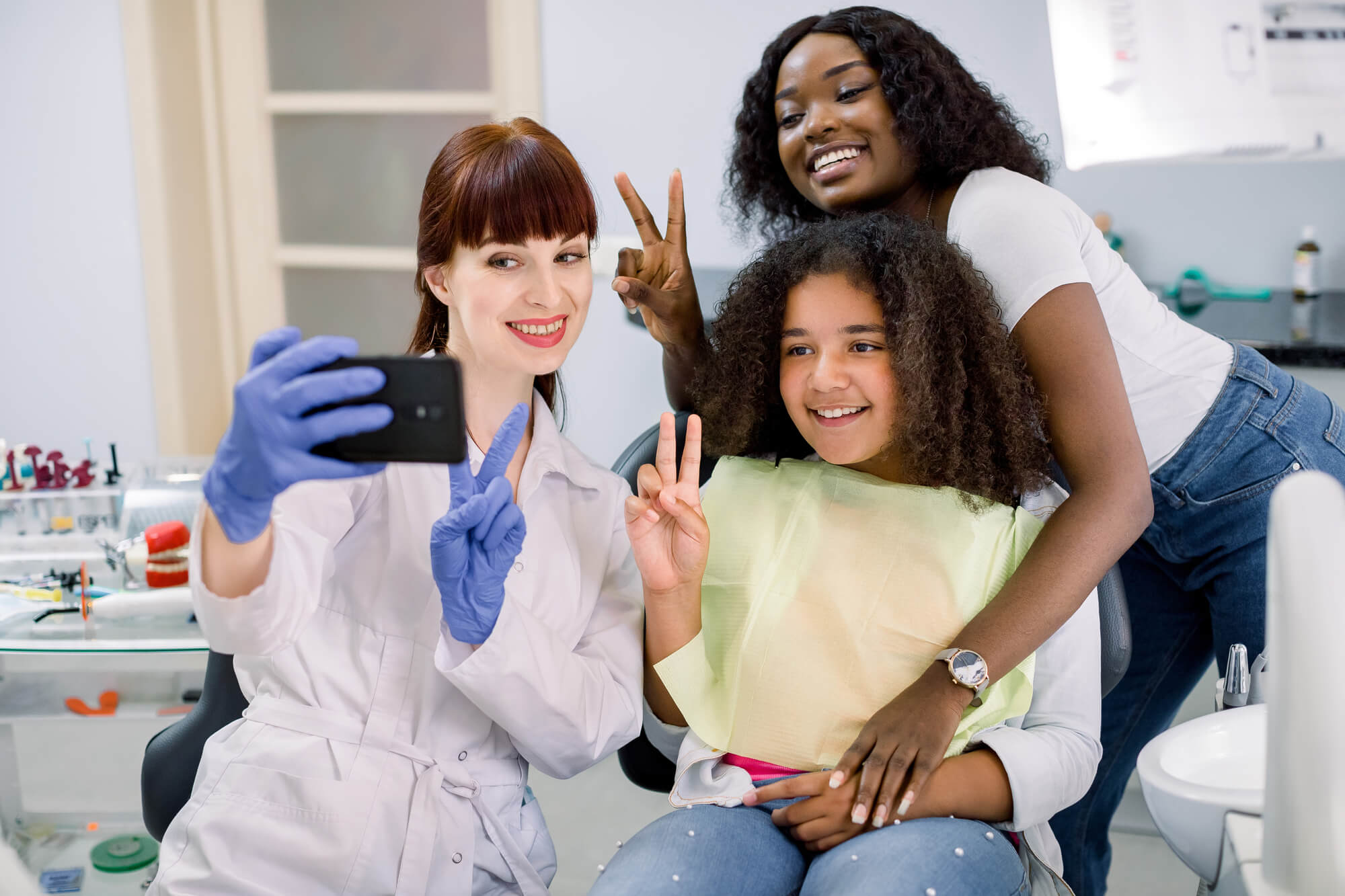 dentist taking a selfie with patients