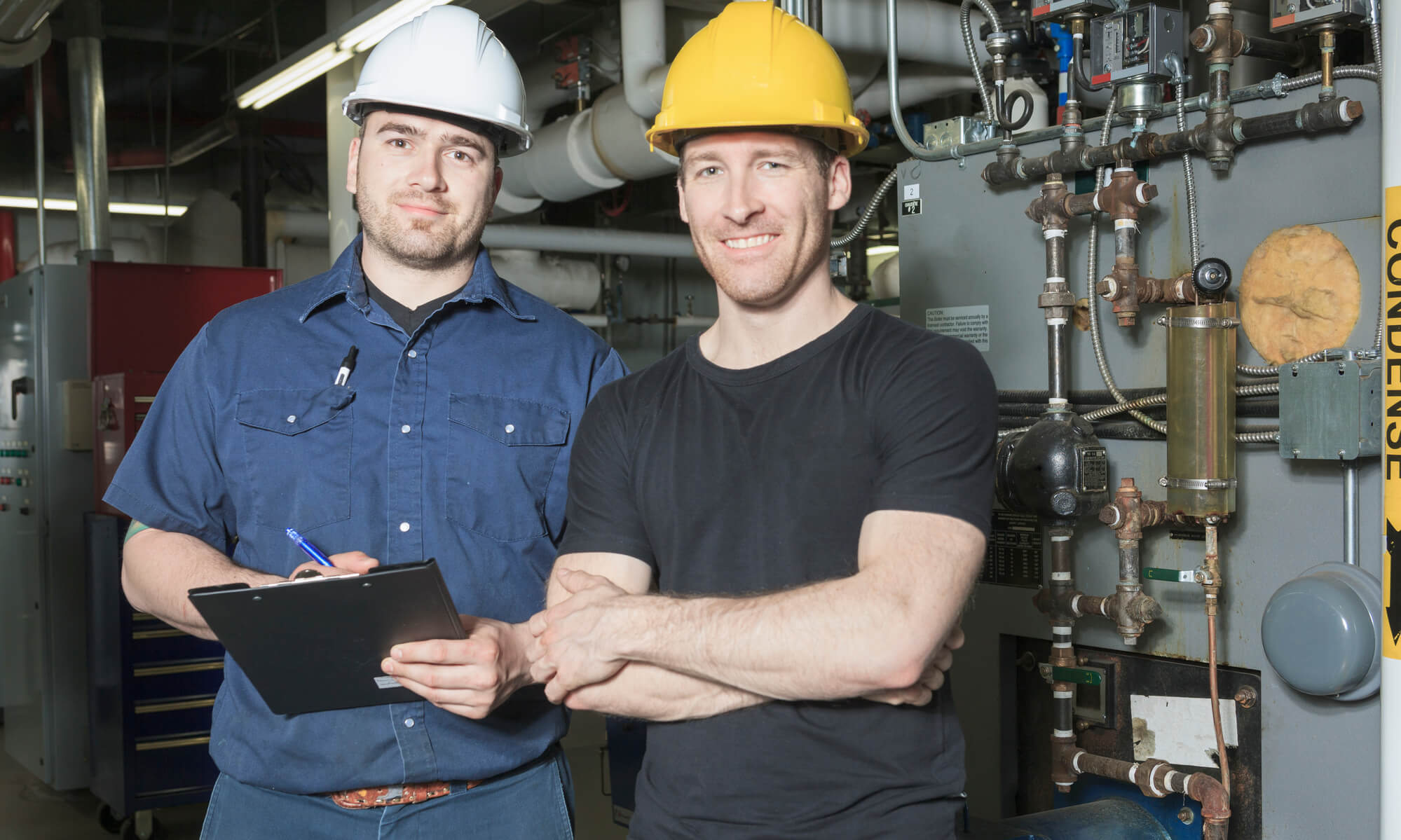 2 HVAC technicians welcoming customers.