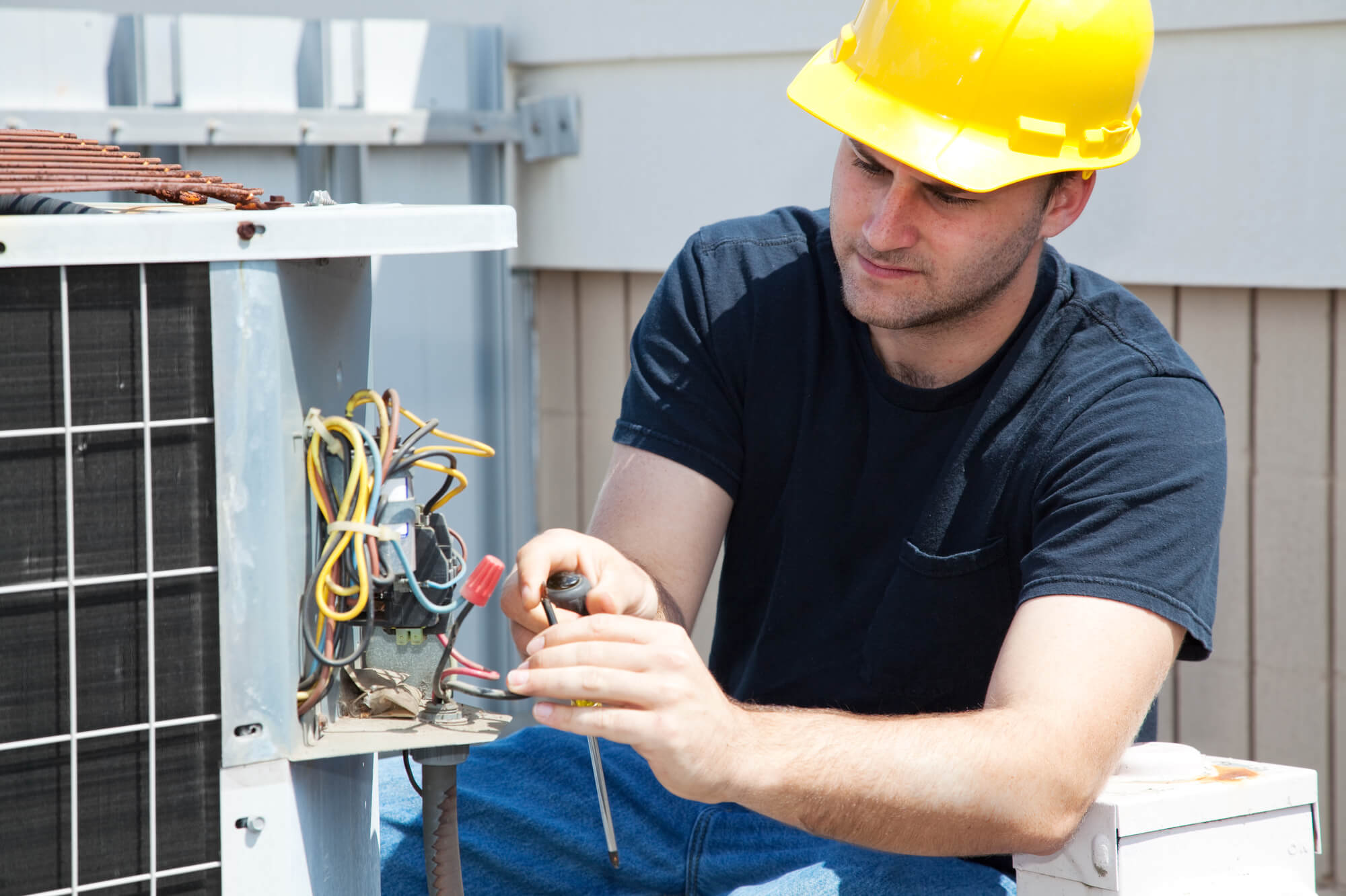 HVAC technician posing for social media content.
