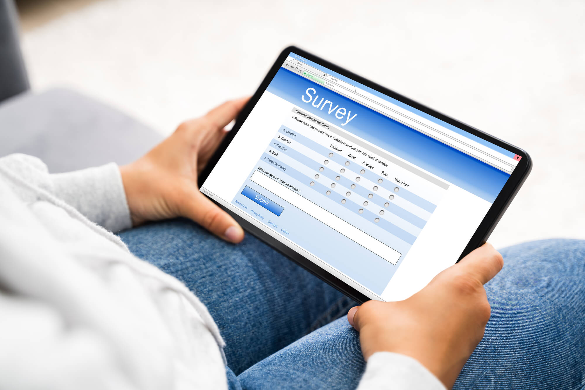 man answering survey on his tablet