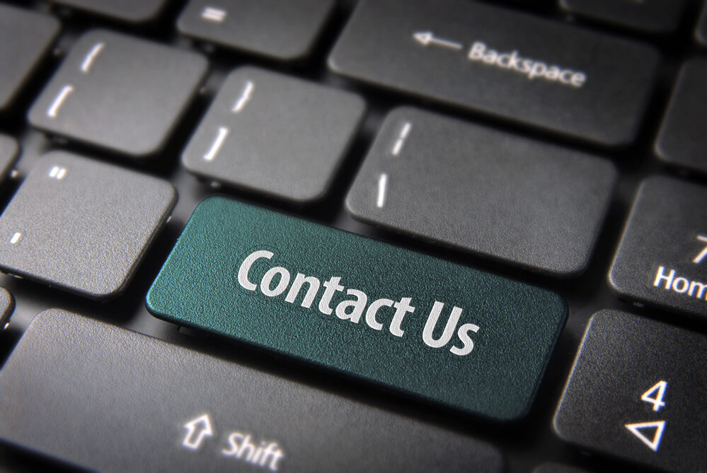 "Contact us" keycaps on keyboard.