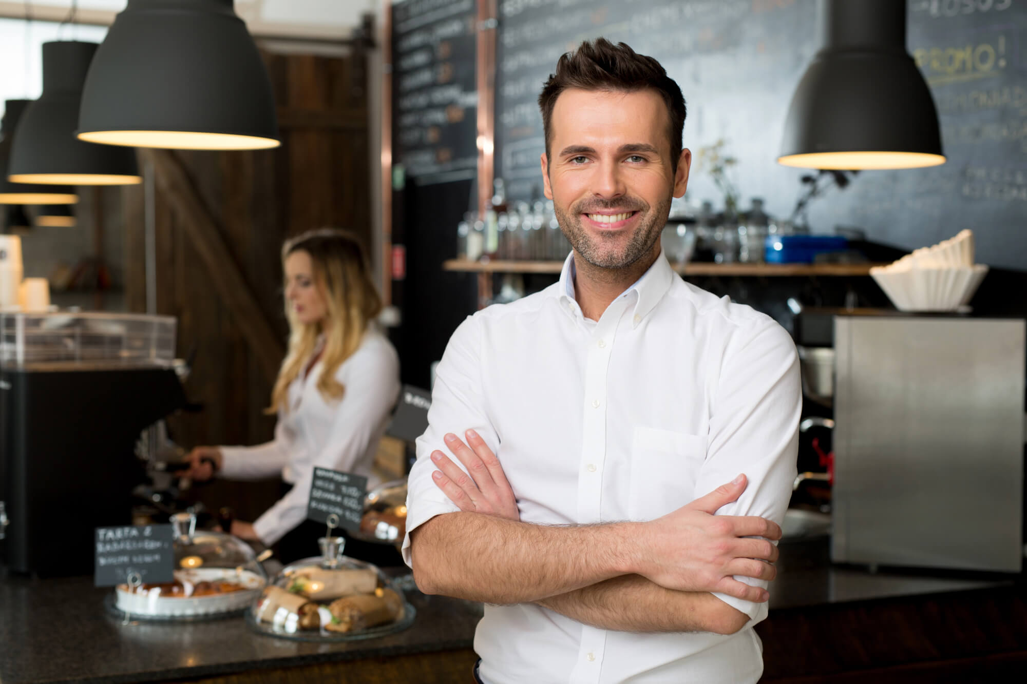 cafe owner smiling confidently