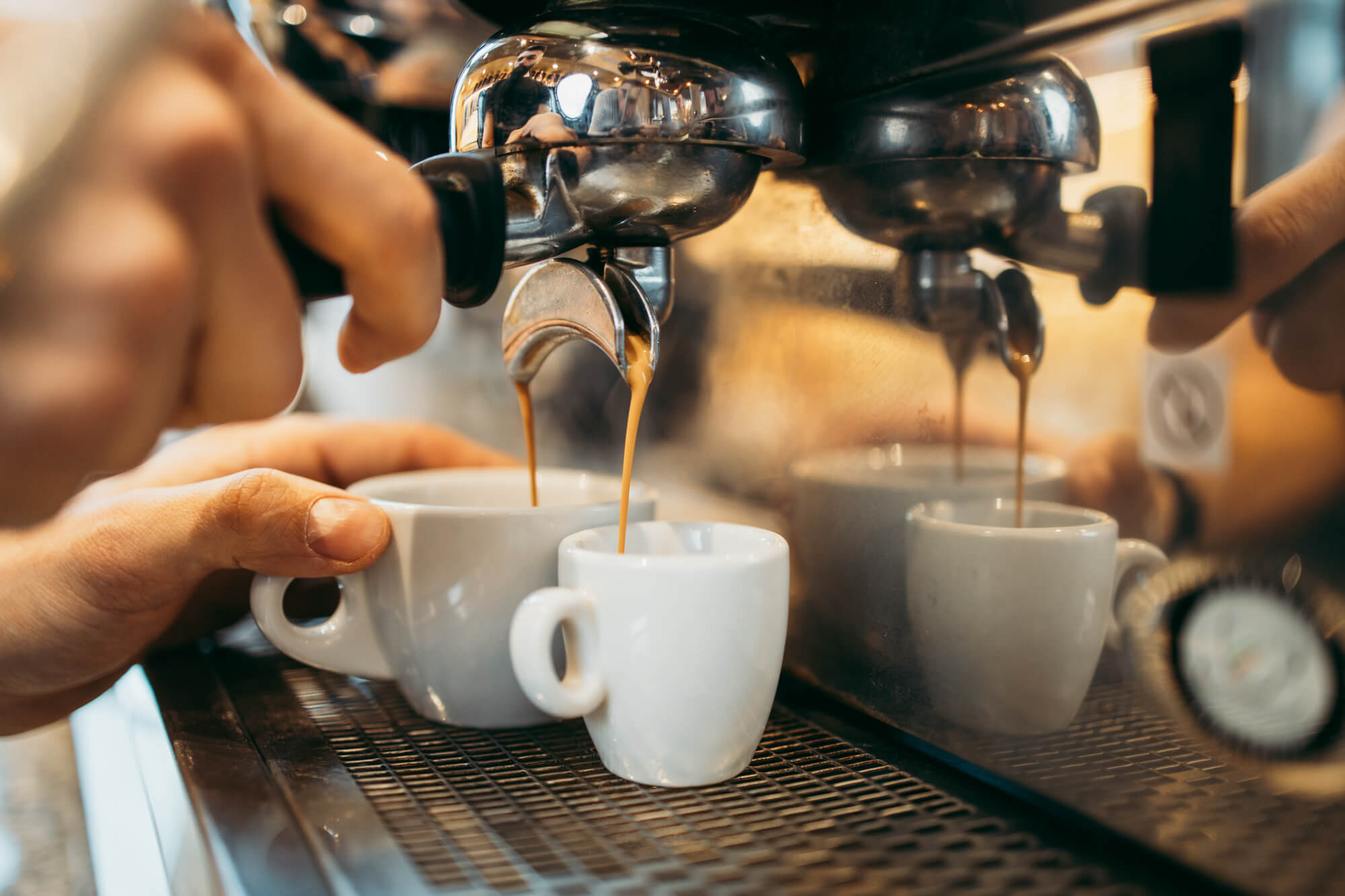 person using espresso machine