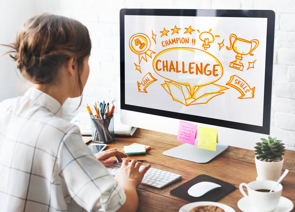 Woman on computer playing online branded contest.