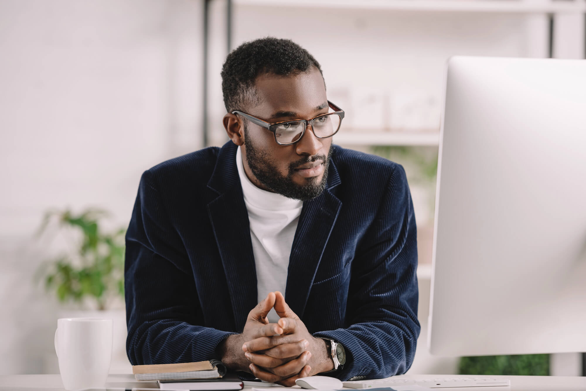 male professional focusing on computer screen