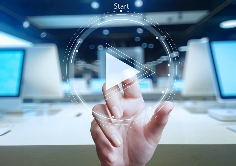 user tapping on the play button after reading video's title.  