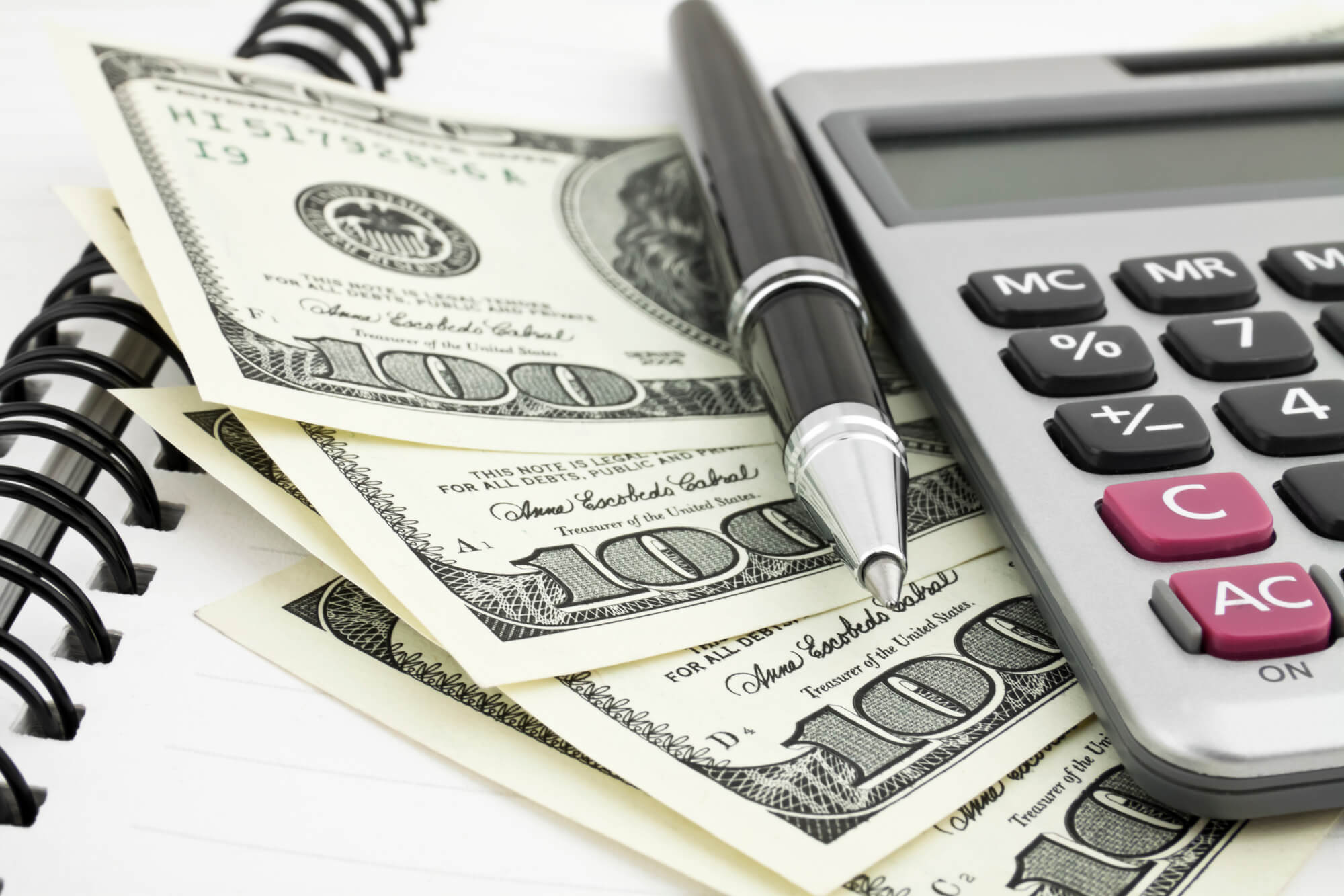 dollars pen and calculator