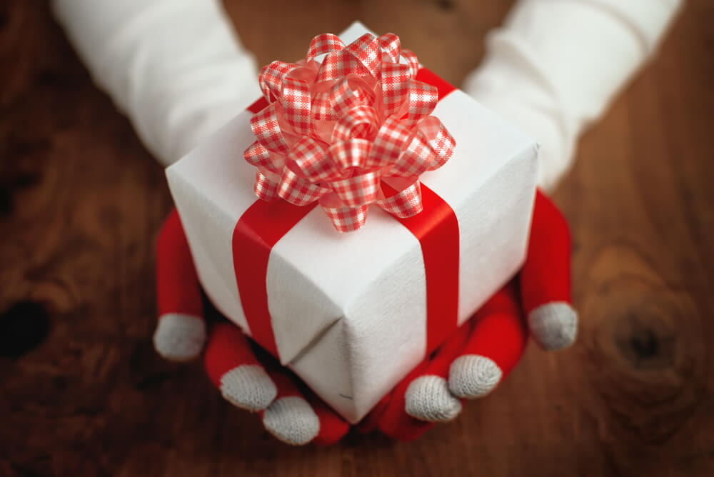 Local SEO in Miami handing out a Christmas gift