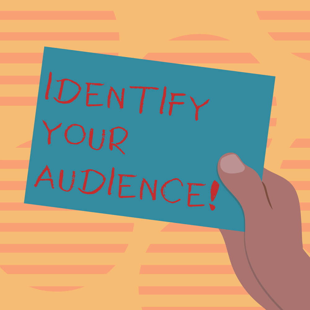 hand holding note saying identify your audience florida internet marketing