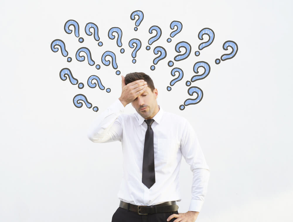 Business man has a headache because of overthinking.