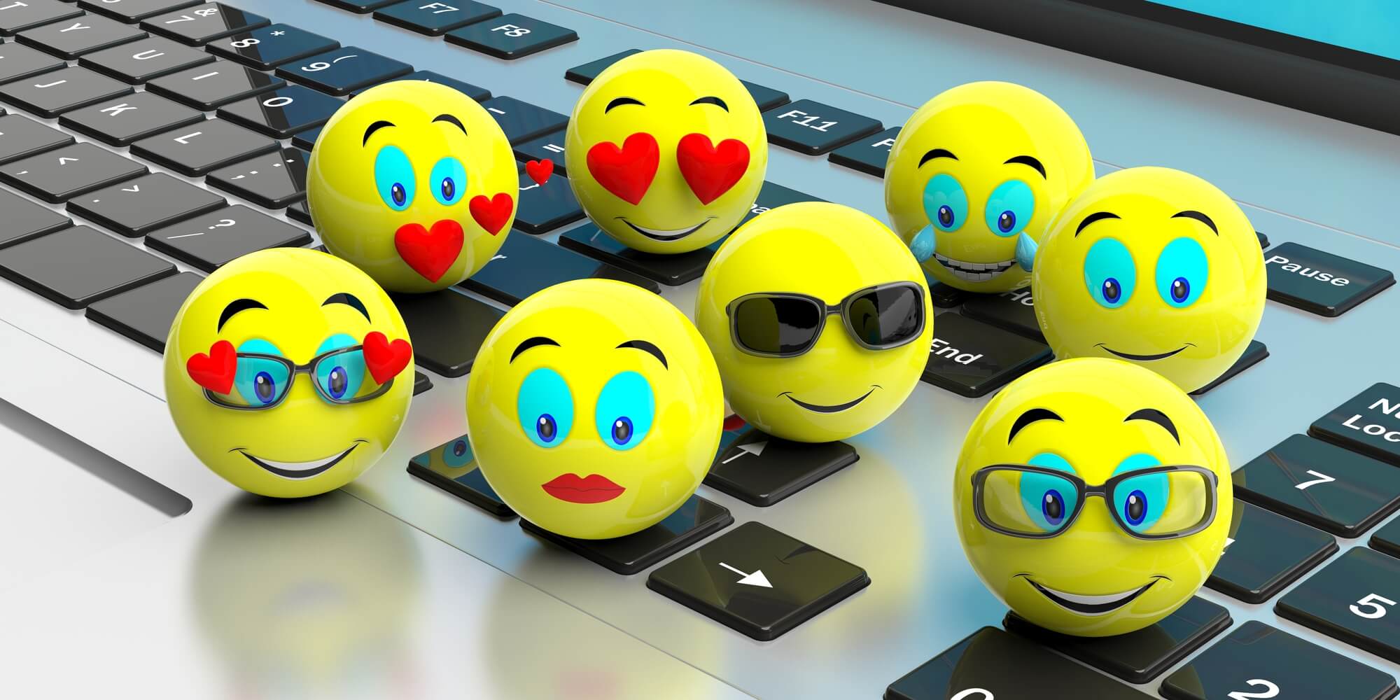 3d yellow emojis on a laptop