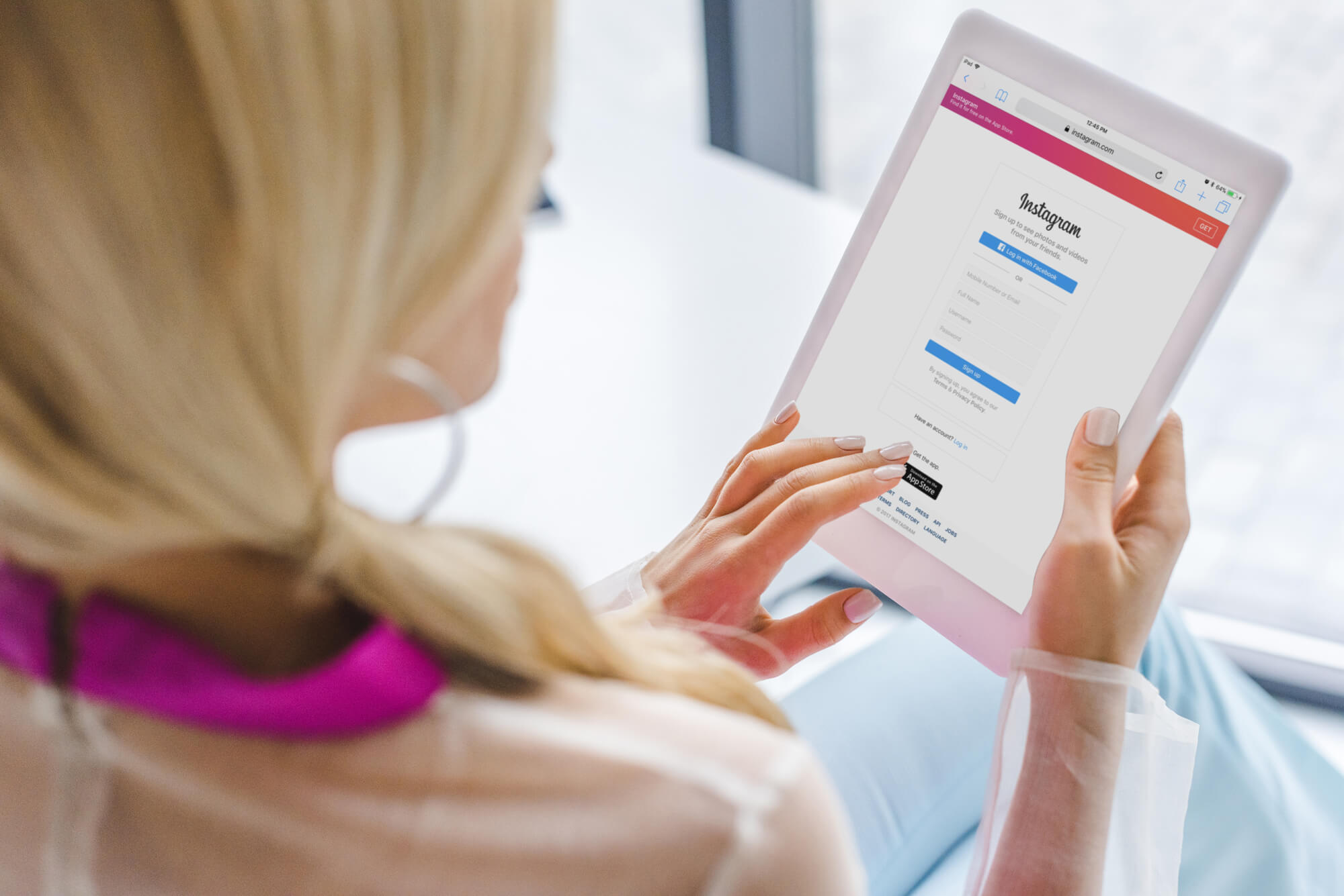 woman using instagram on tablet