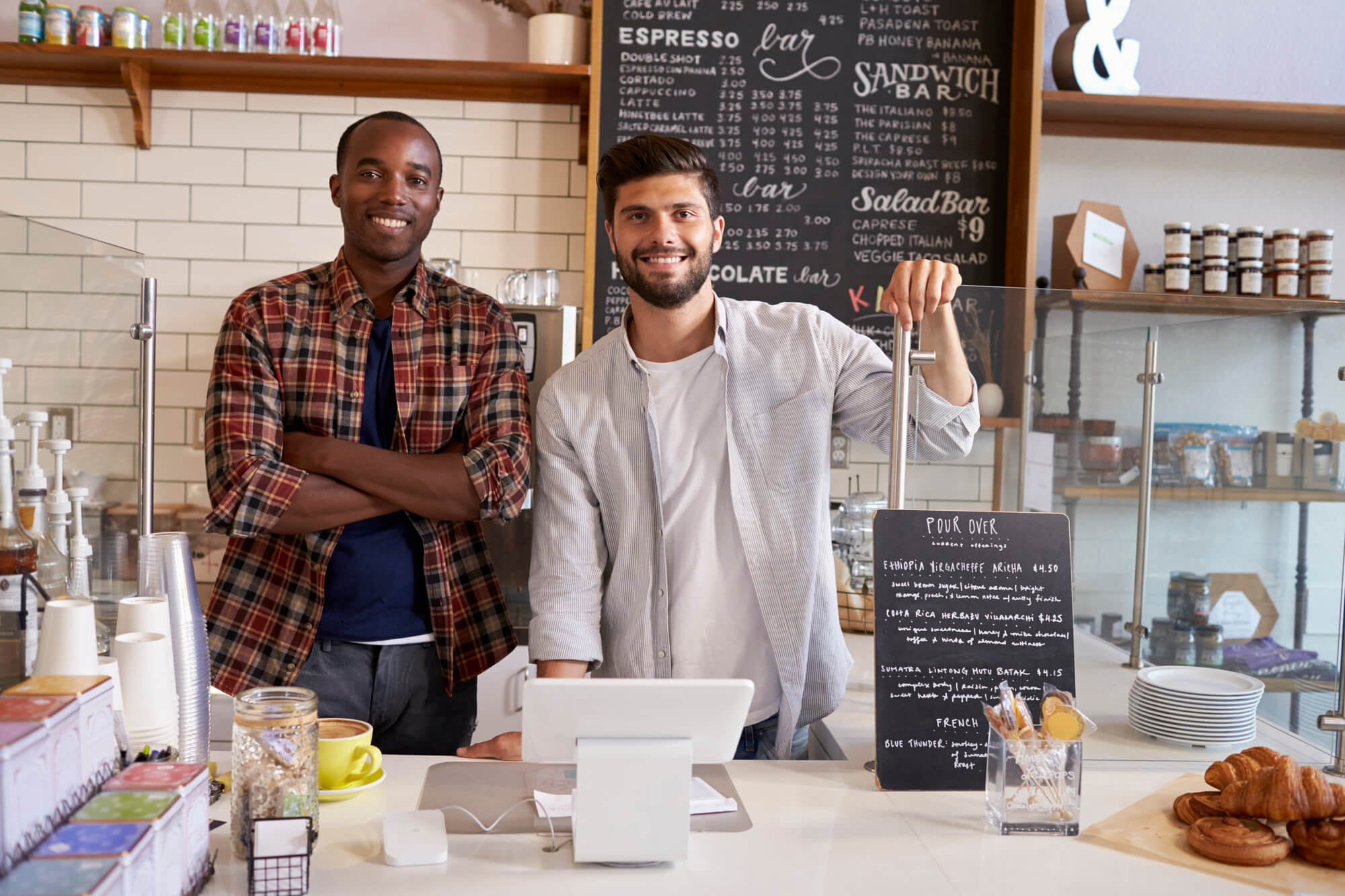 local business partners in front of their store