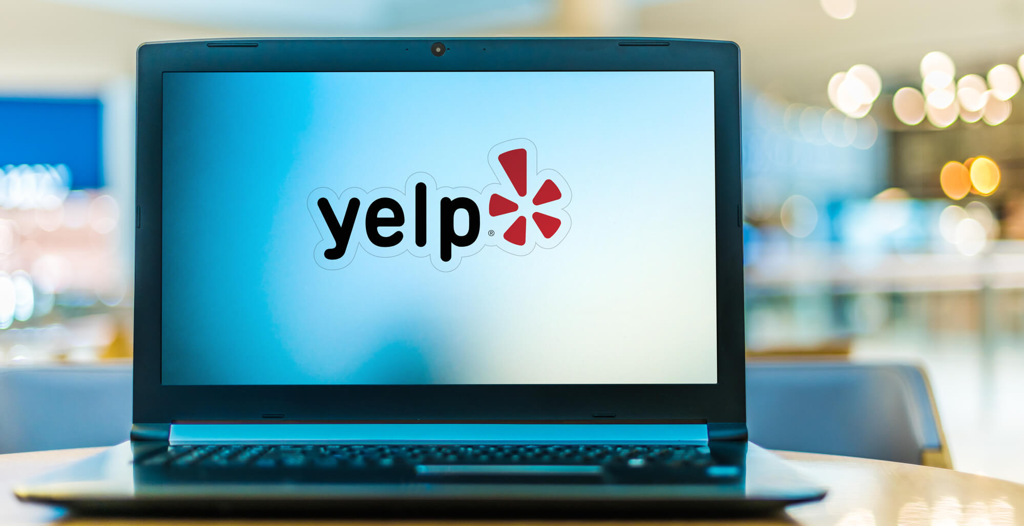 laptop showing yelp logo