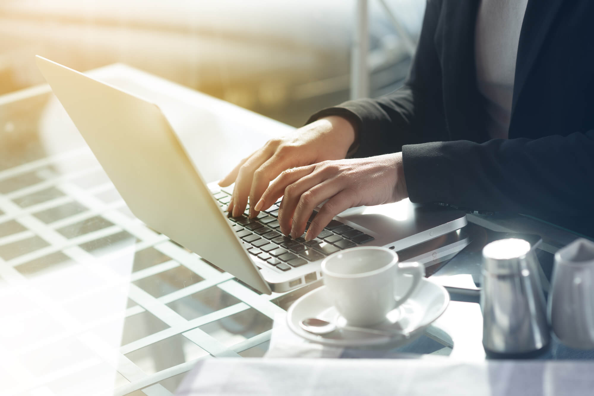 woman typing on laptop