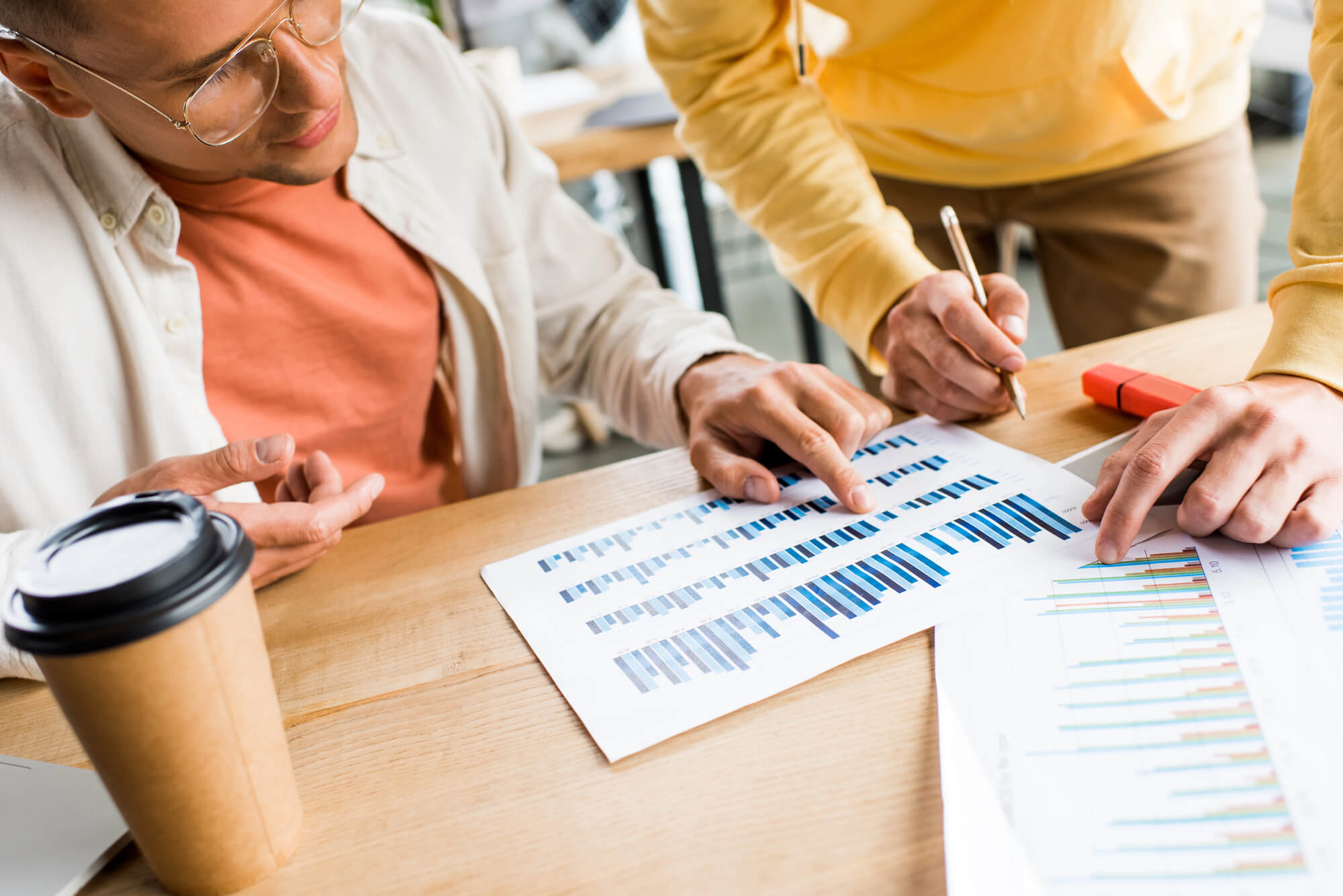 two young male entrepreneurs assessing graphs