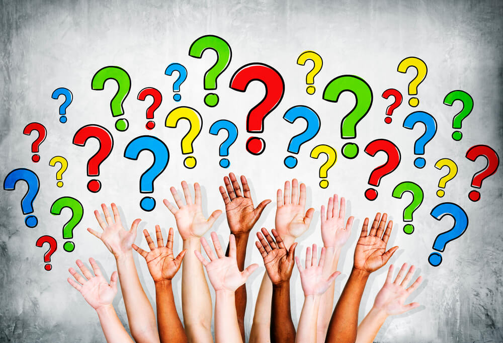 customers' arms outstretched to ask questions