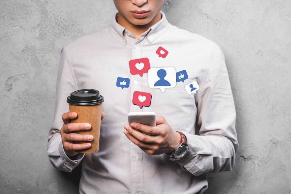 Digital marketer in Miami monitoring social media interaction and replying to comments.