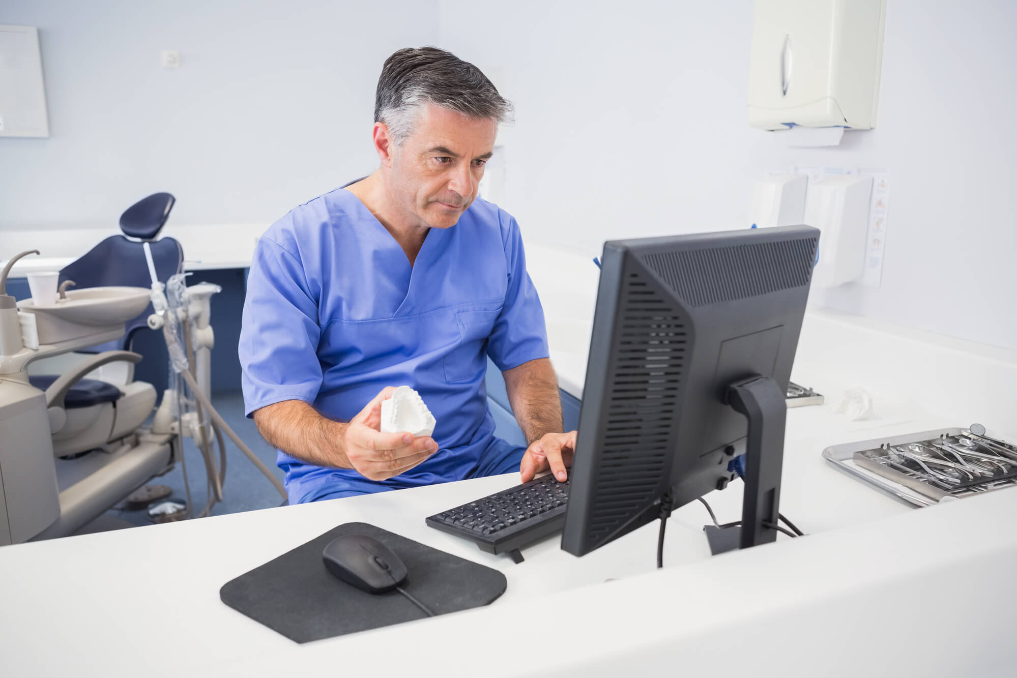 dentist working on computer