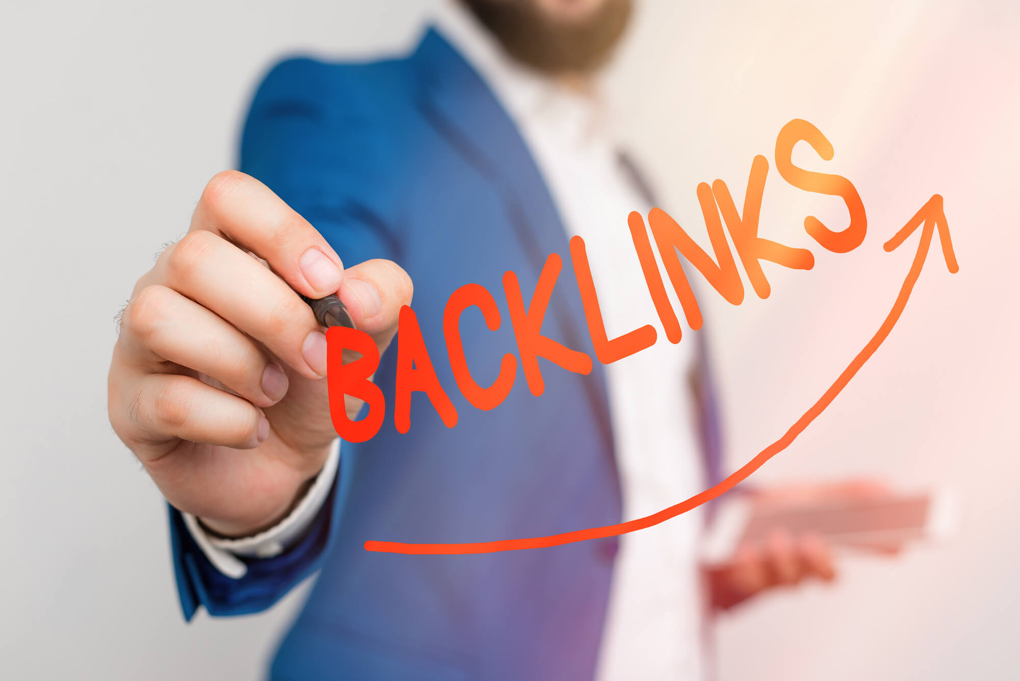 businessman writing backlinks word
