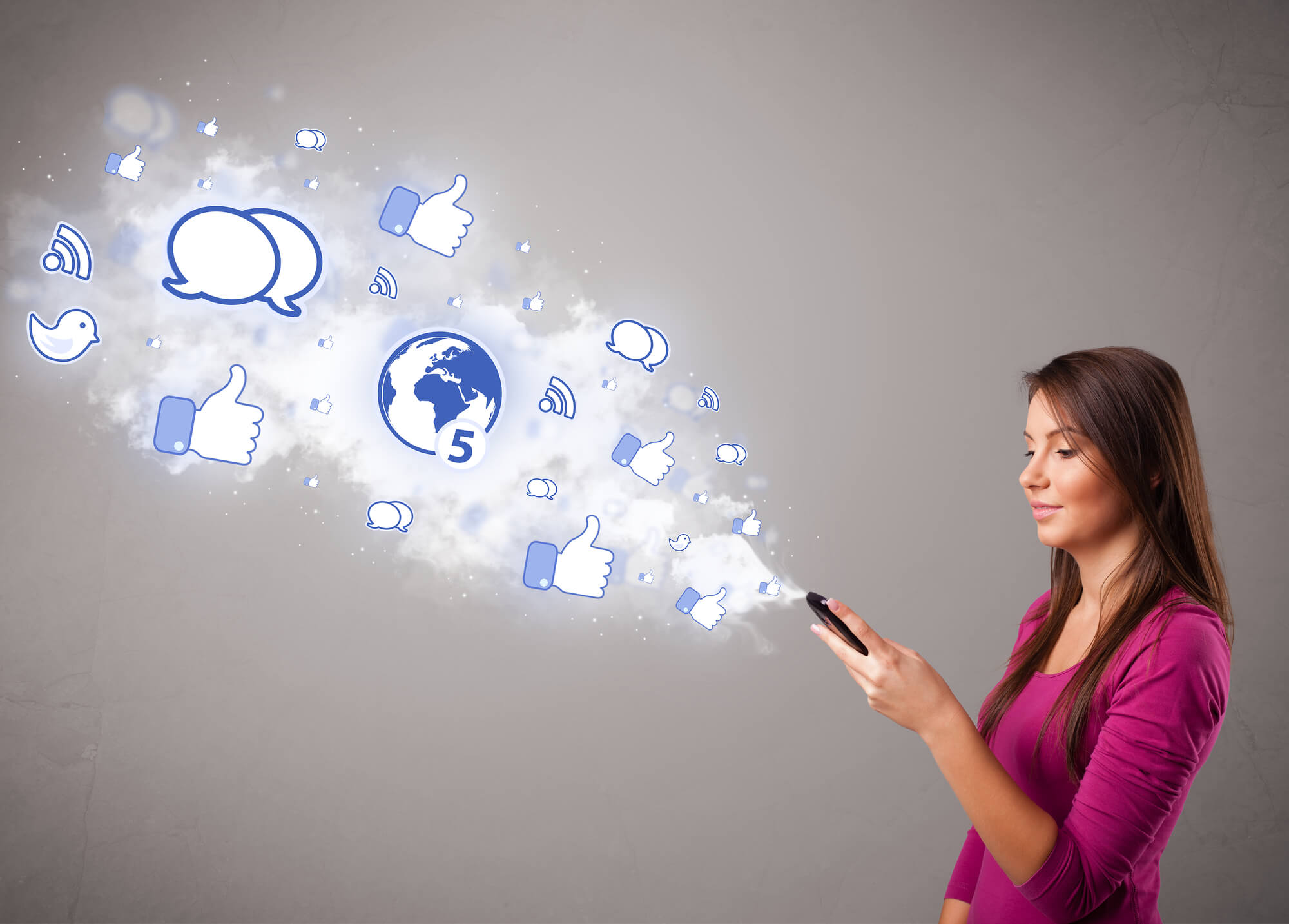 woman holding phone with social media icons 