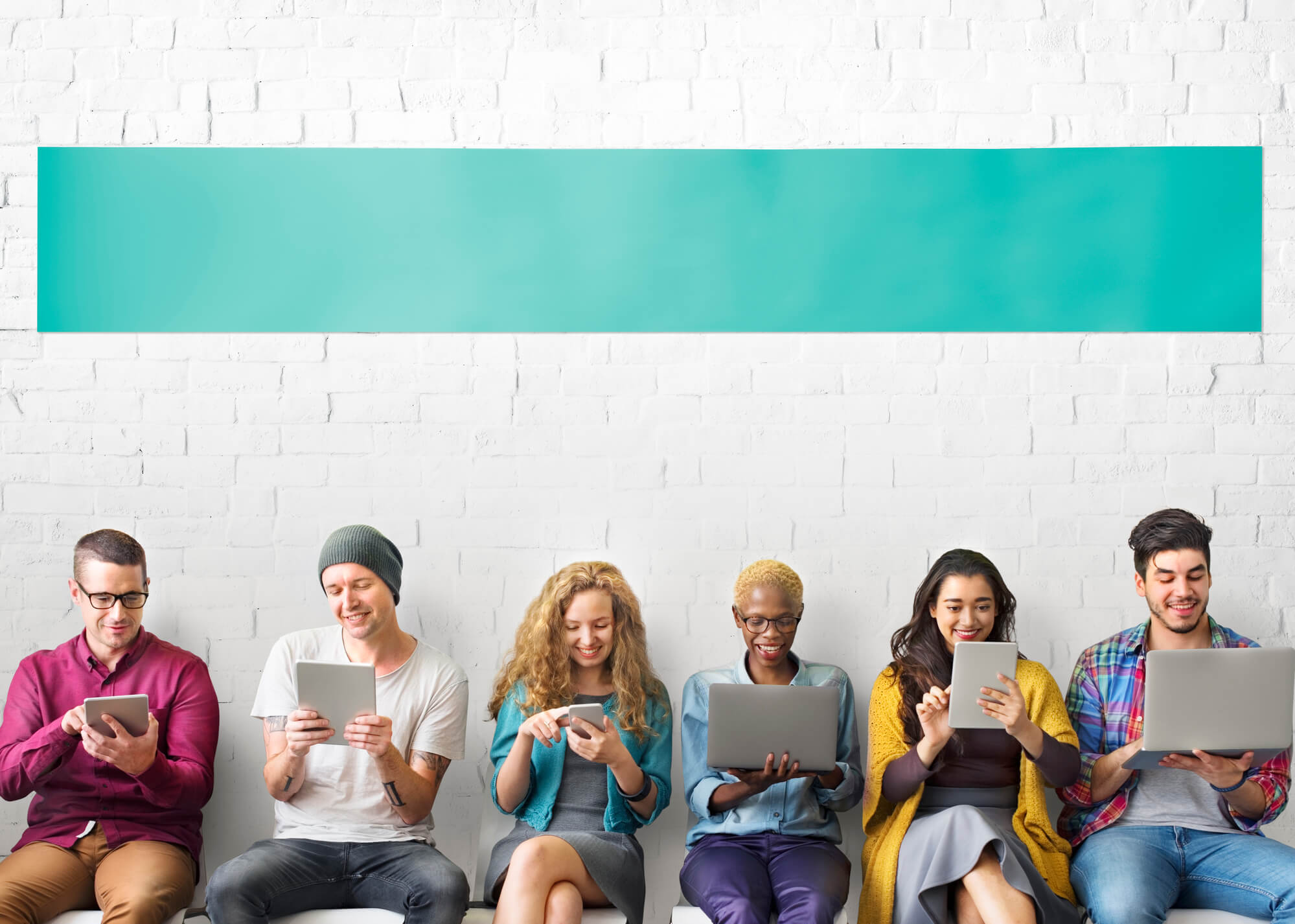 group of young people using their mobile devices