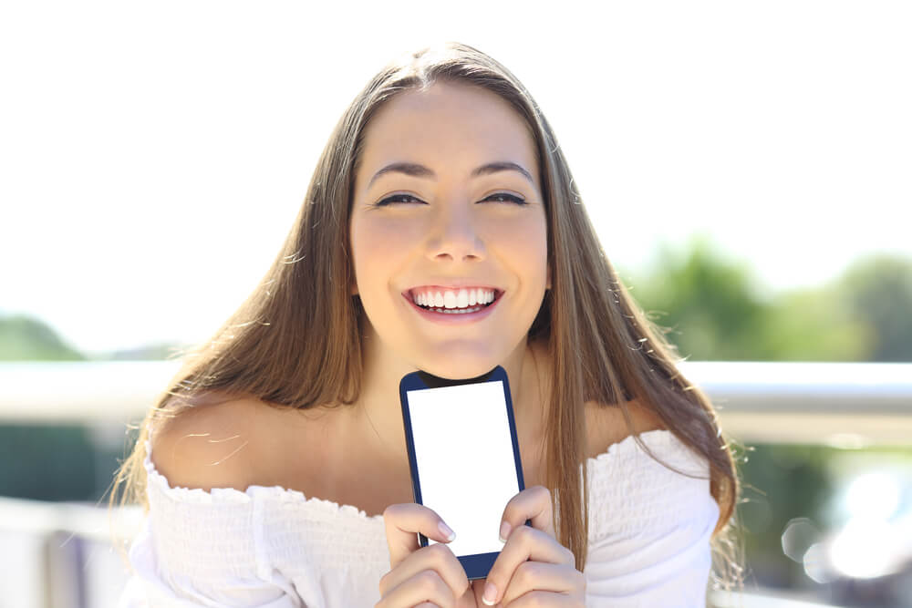 happy patient holding smart phone. 
