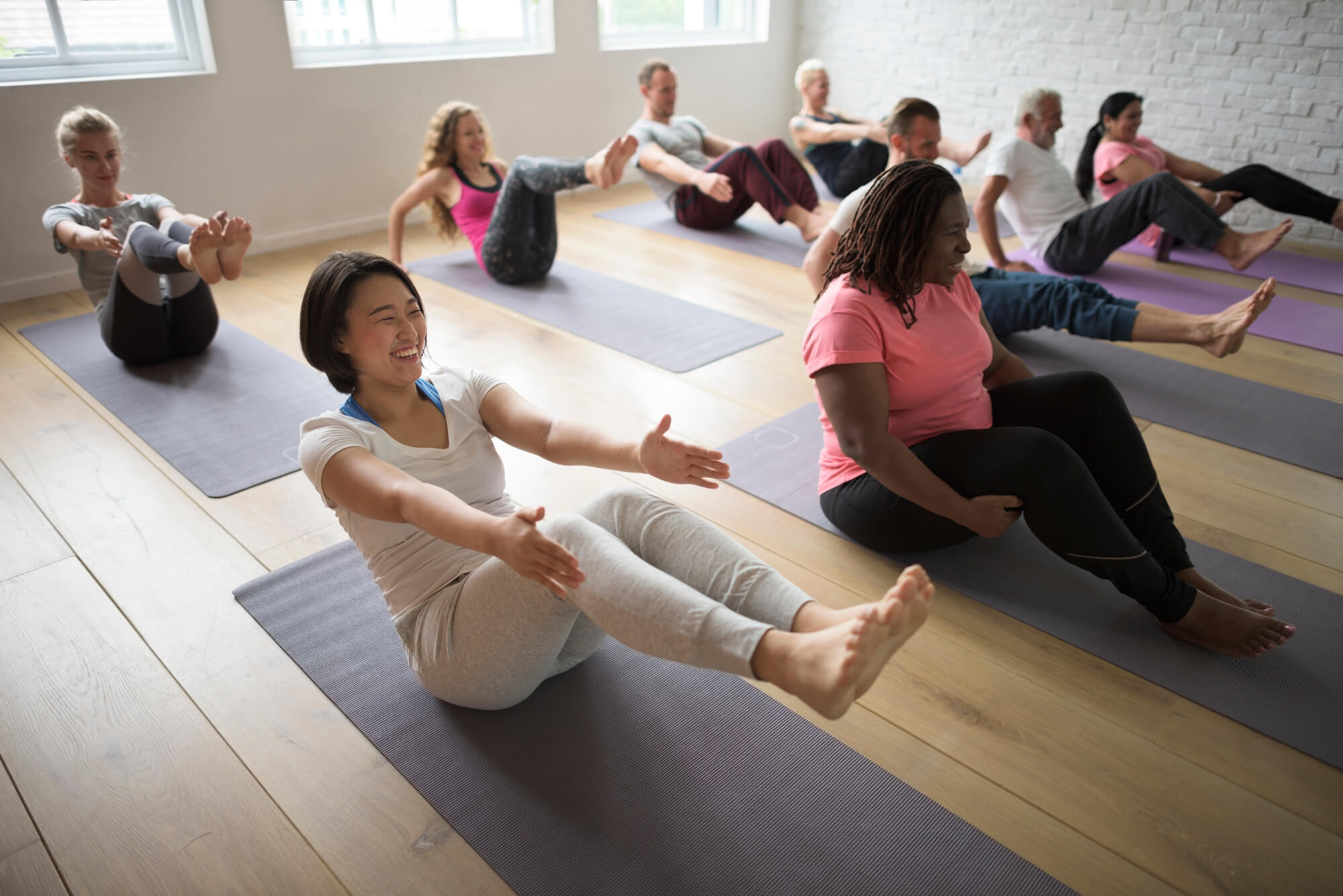 people stretching in an exercise class