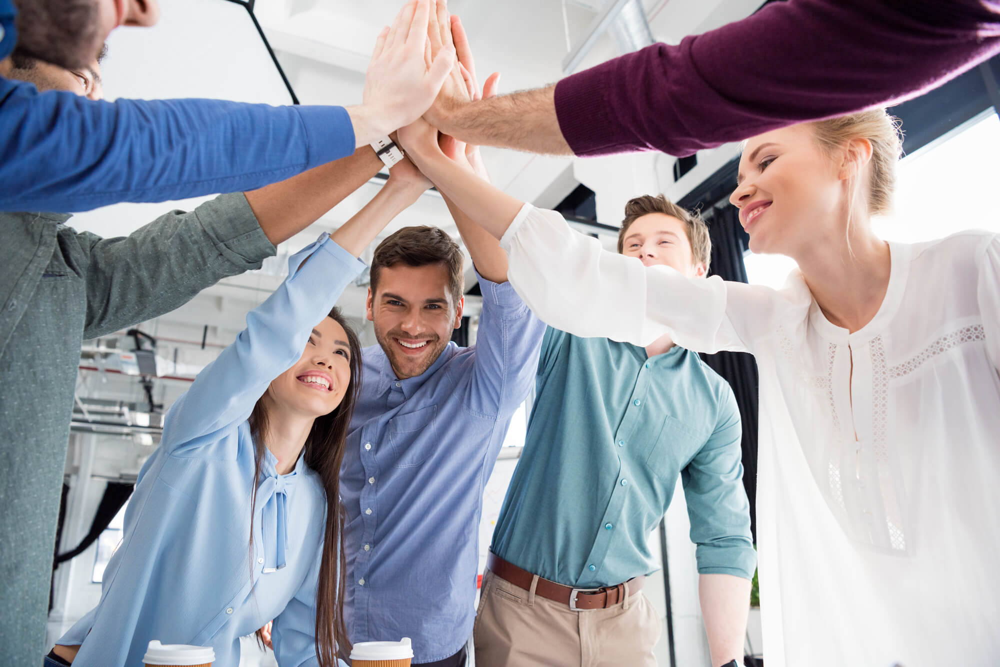 team members giving each other high fives