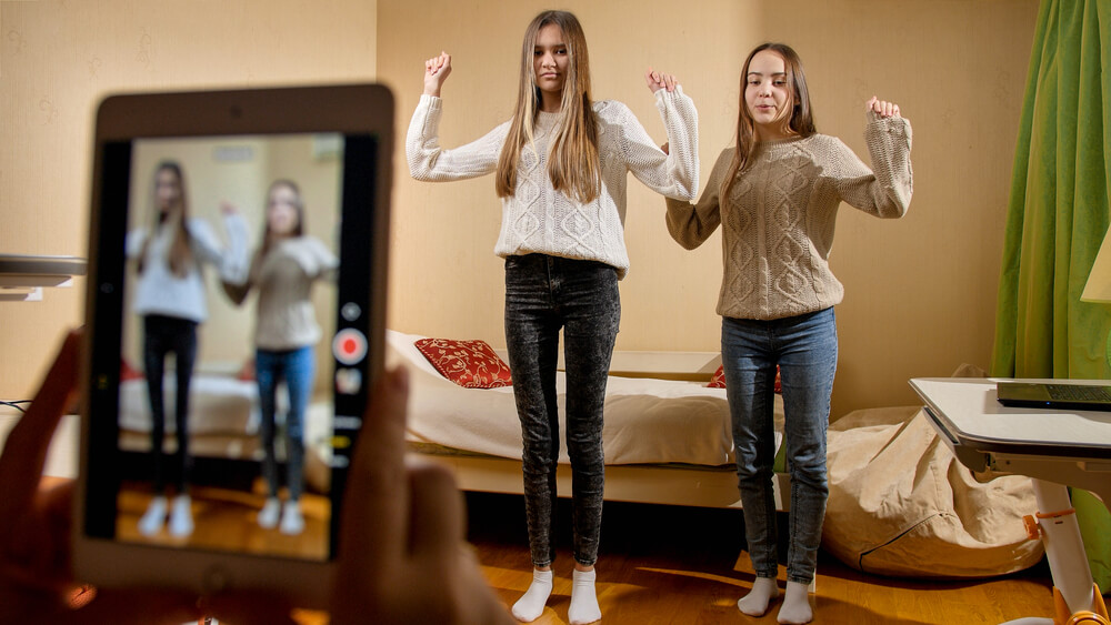 two business owners joining dance challenges on TikTok.
