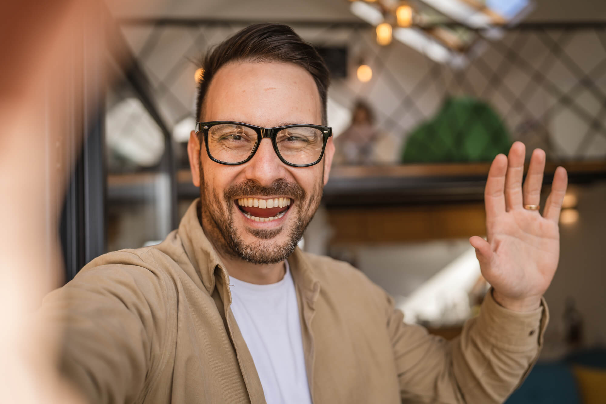 happy man recording a video of himself on phone 