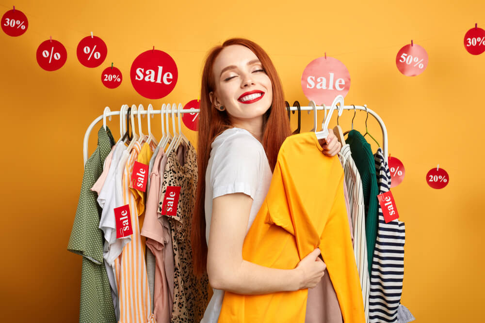 Customer buys new clothes because they were on sale. 