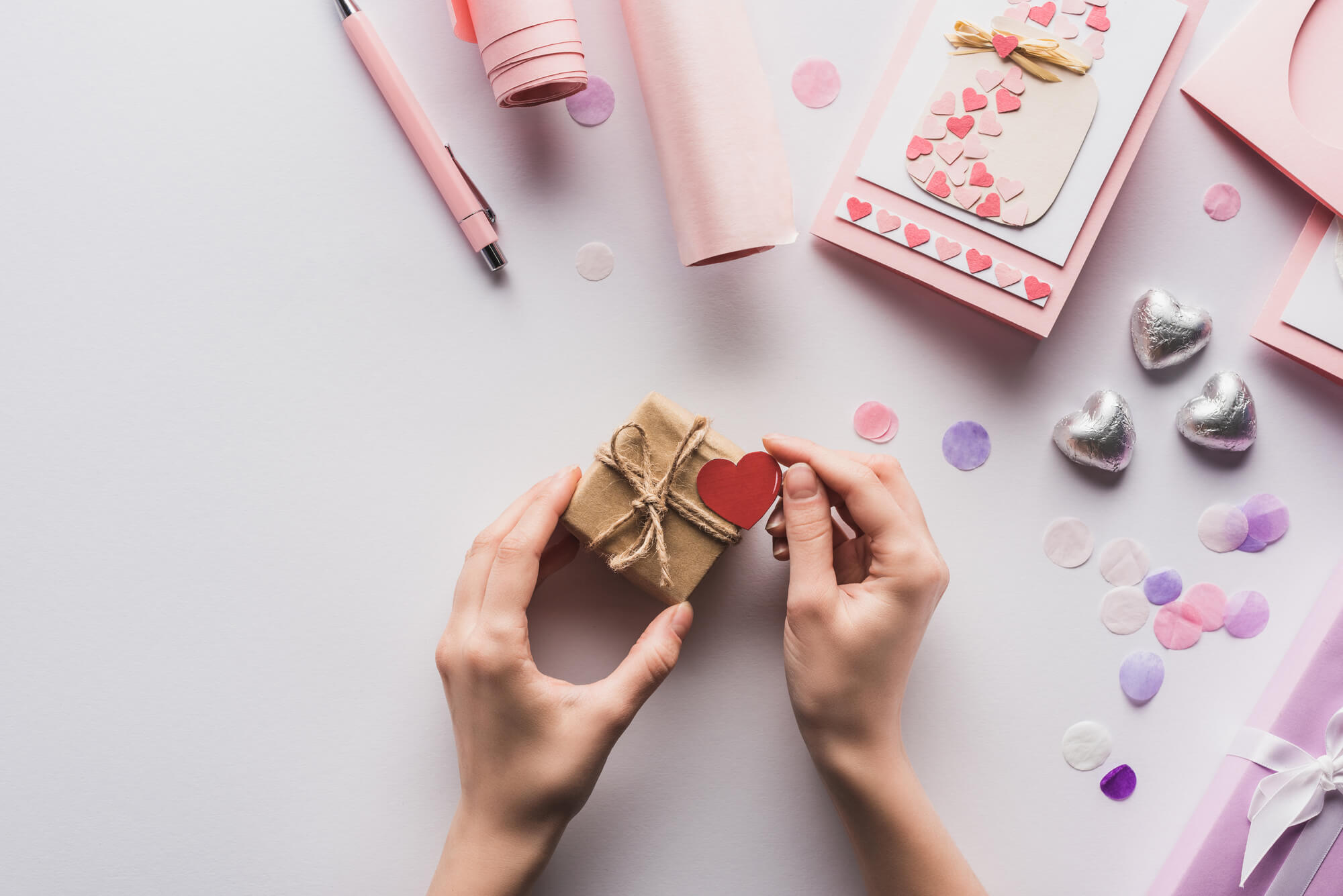 woman holding gift box with heart
