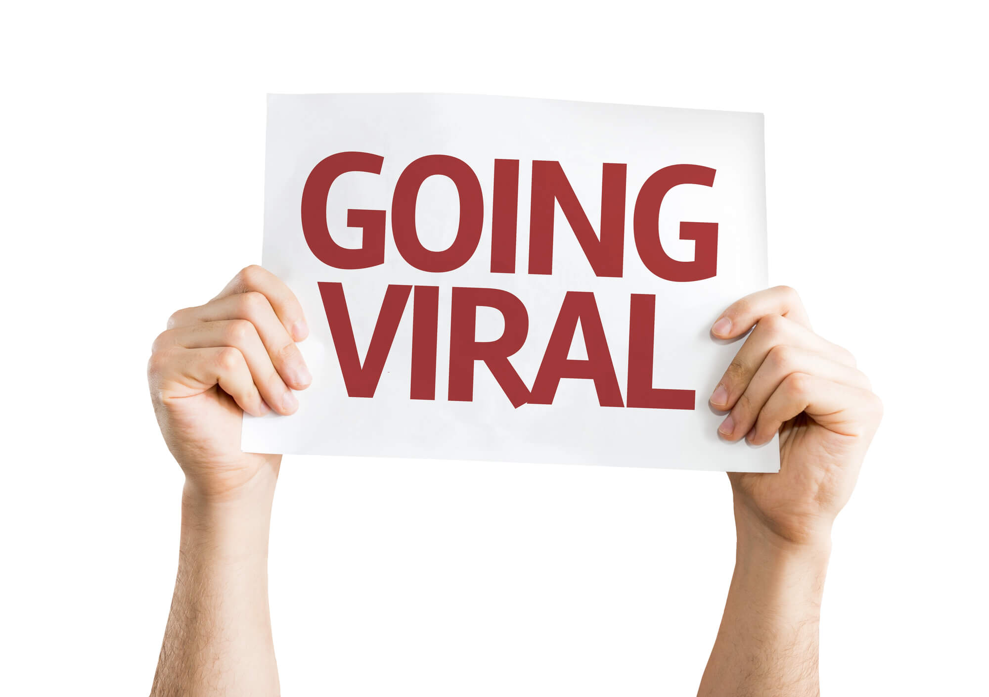 Person holding sign that says "GOING VIRAL"