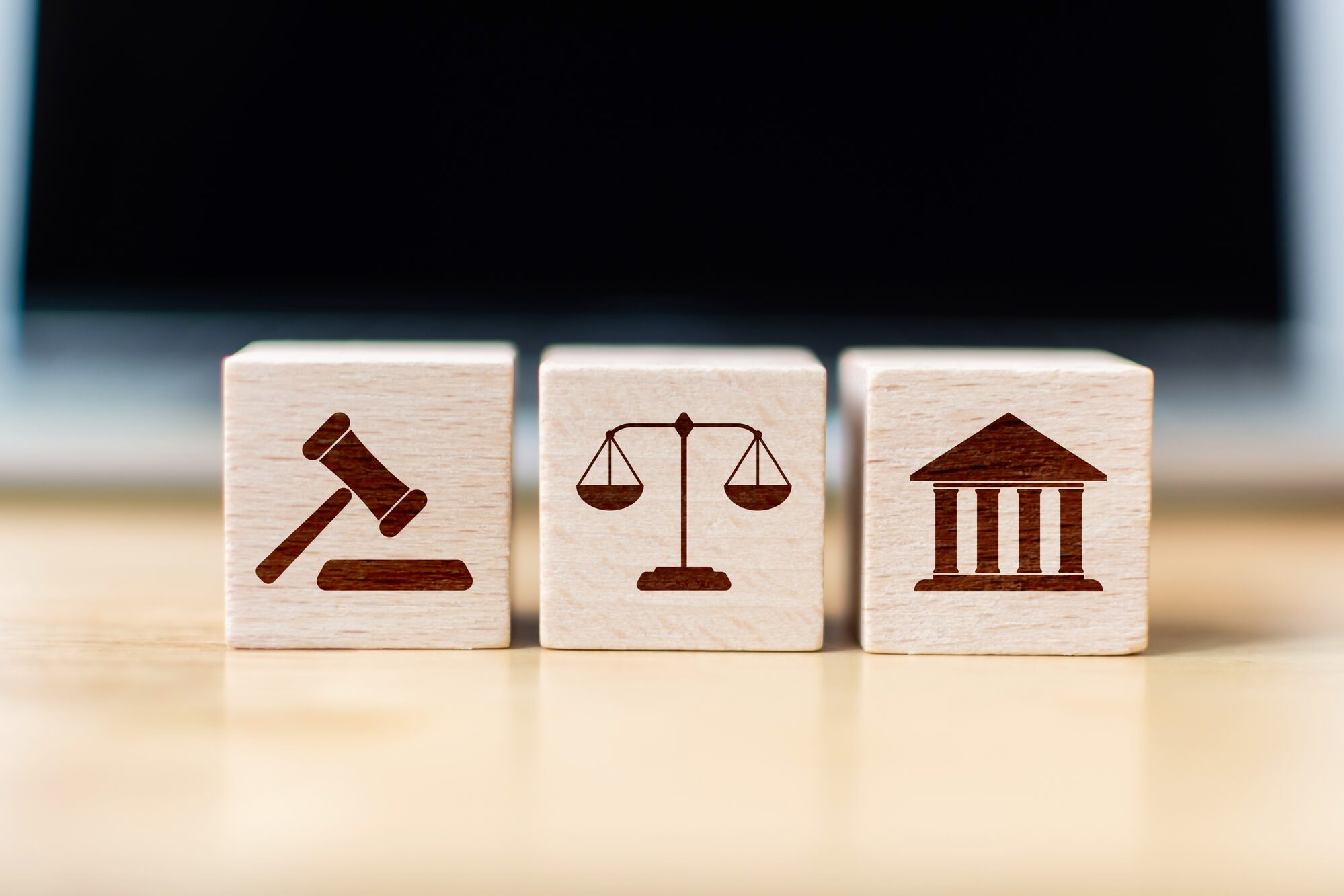 wooden cubes with legal justice icons 