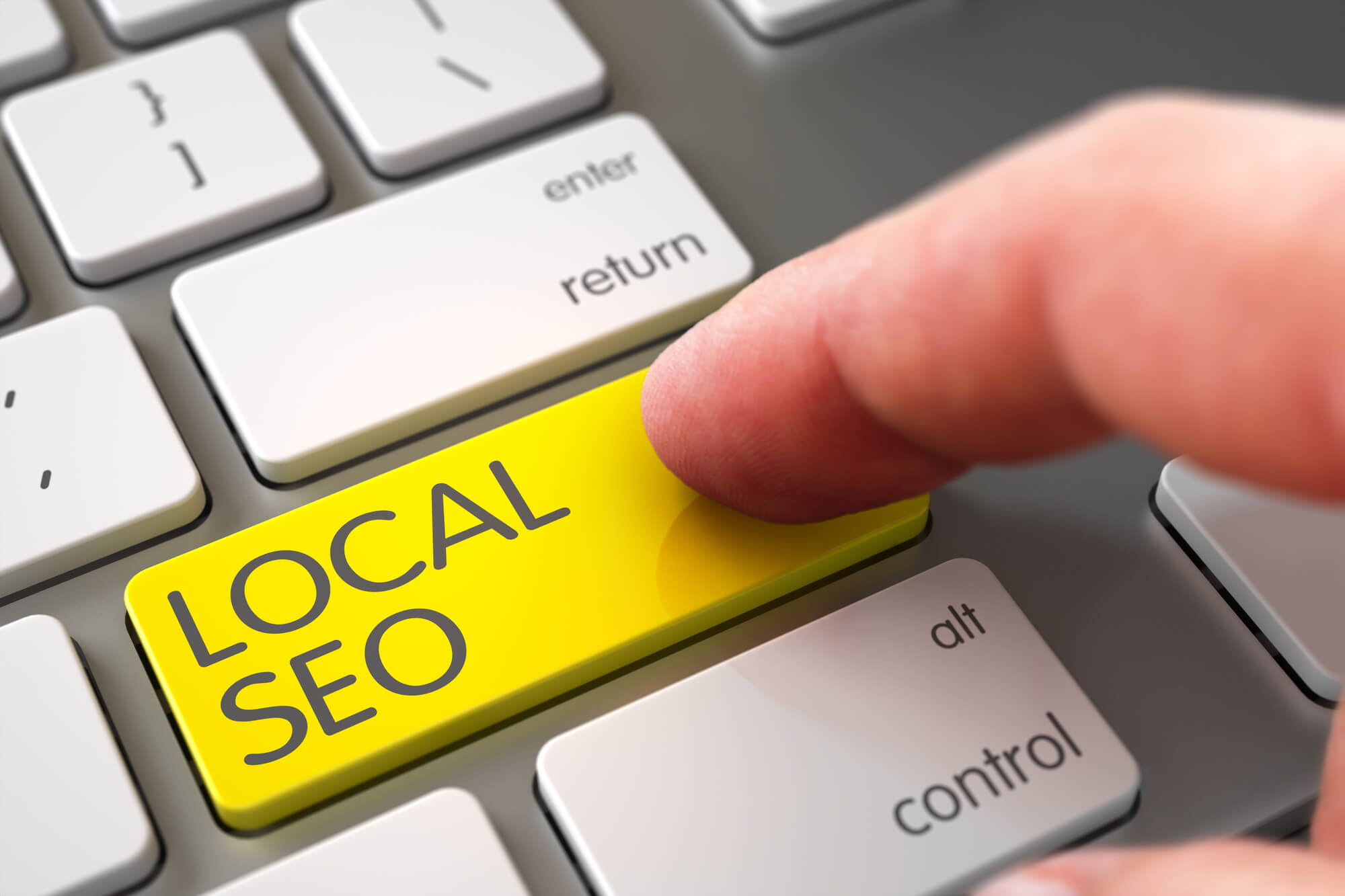 finger pressing local seo on keypad